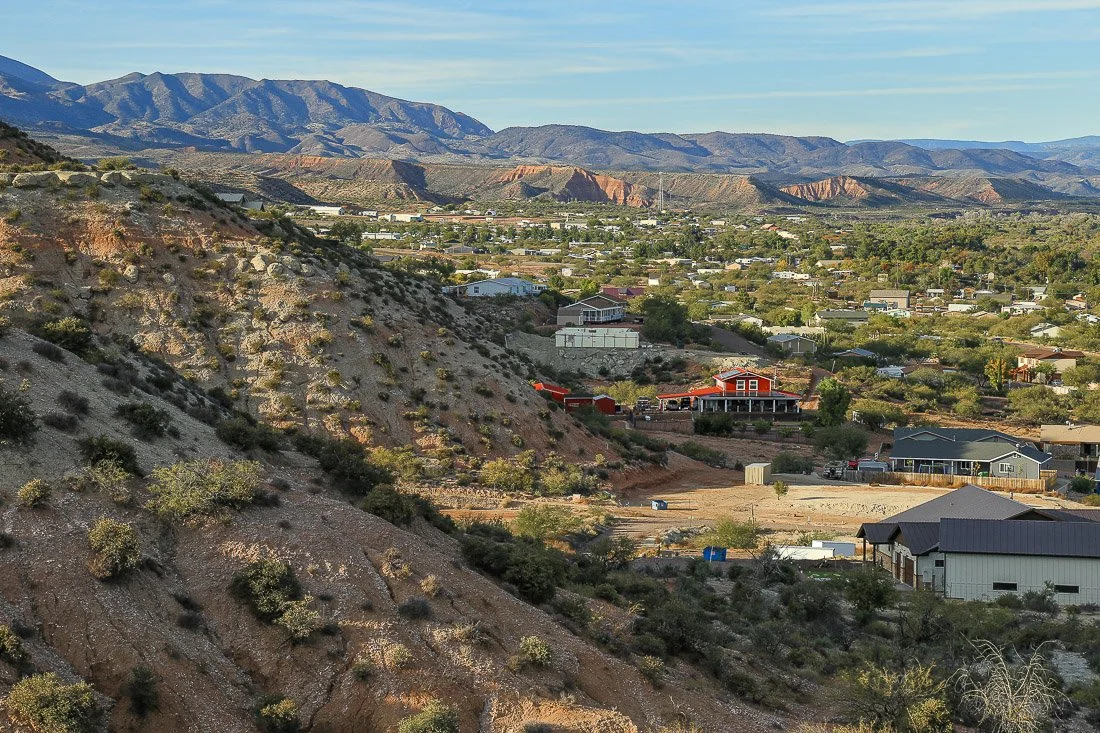 The village of Tonto Basin nestled among red and white hills.