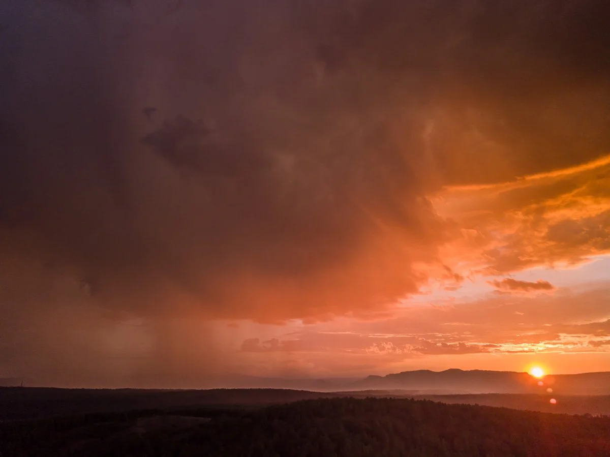 The sun sets behind a summer storm near Strawberry.