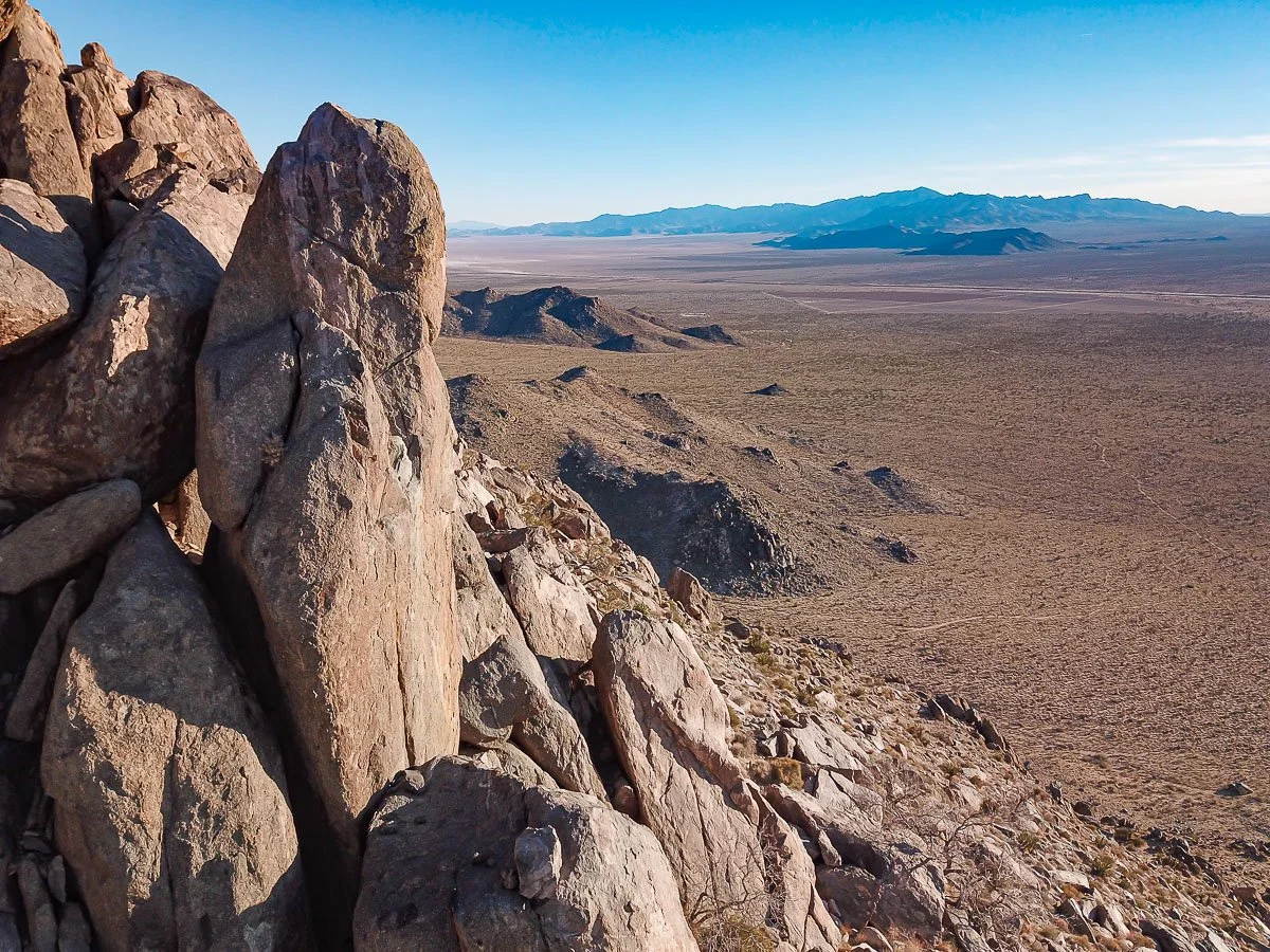 Giant vertical boulder overlooks Mojave Desert