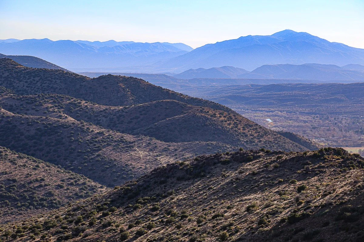 Rows of purple mountains from Hells Gate, east of Gisela. 