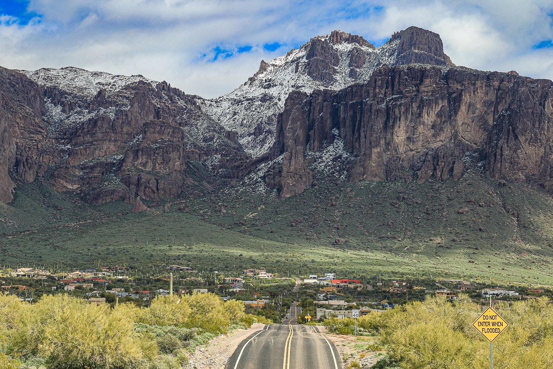 The snow-covered west face of the Superstition Mountains.