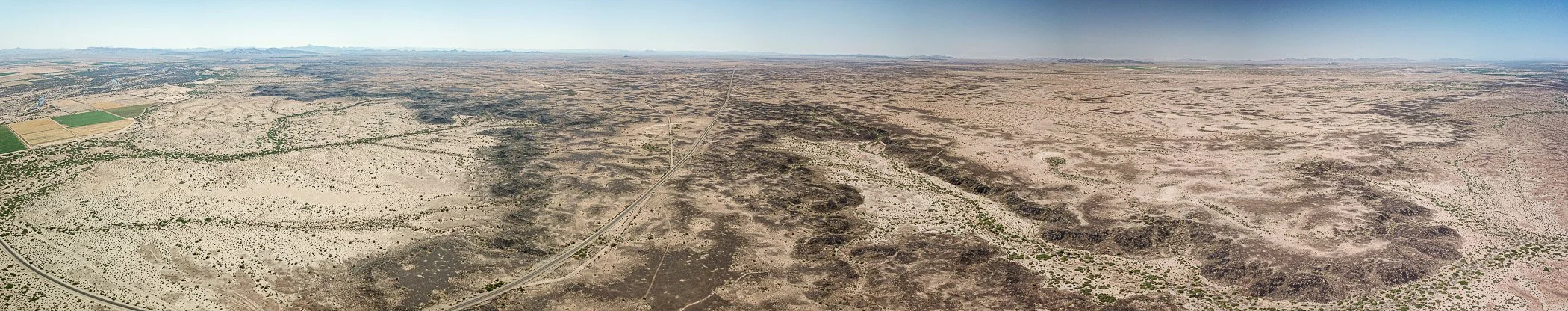 The Sentinel volcanic field in hyper-arid southwestern Arizona is some of Arizona's youngest volcanic rocks. Silt and sand blown by dry desert winds have mantled much of the landscape.