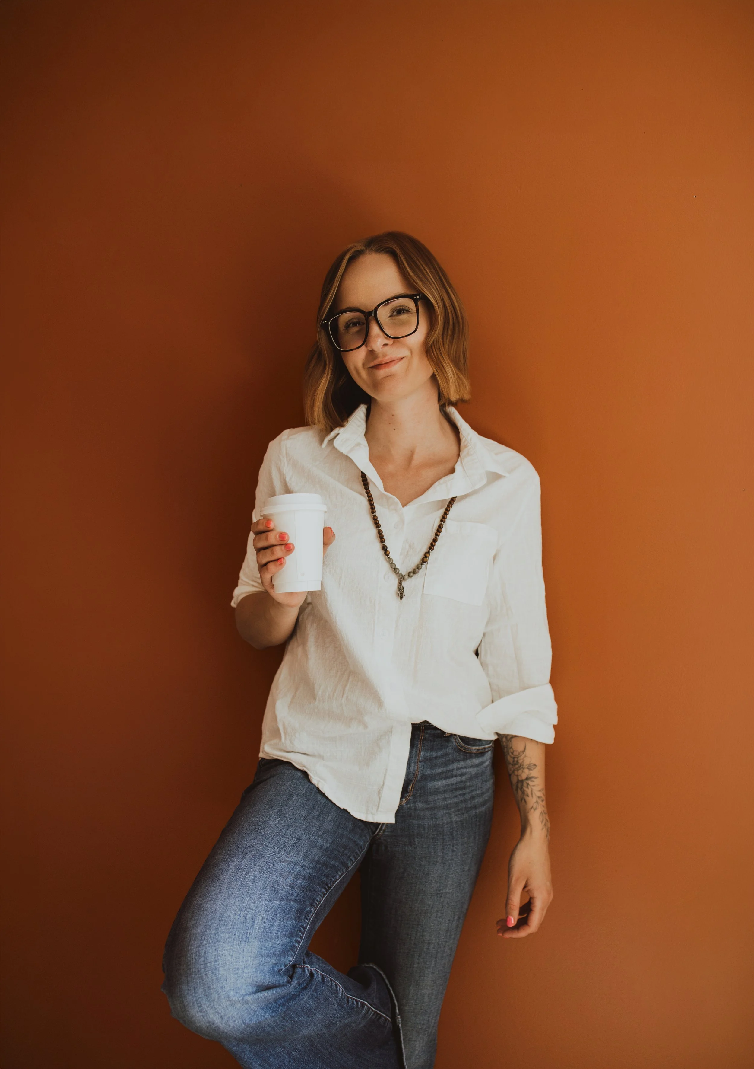 Kaylee Erlandson, Acupuncturist standing in treatment room in Okotoks Alberta
