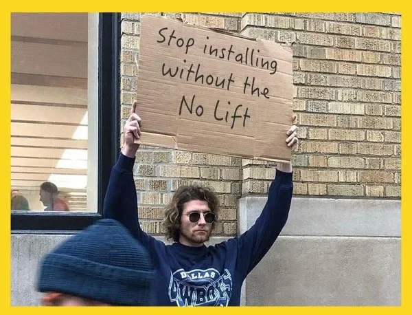 A young man with wavy hair, wearing sunglasses, and a Dallas Cowboys sweatshirt, stands against a brick wall holding a cardboard sign that reads, 'Stop installing without the No Lift.'