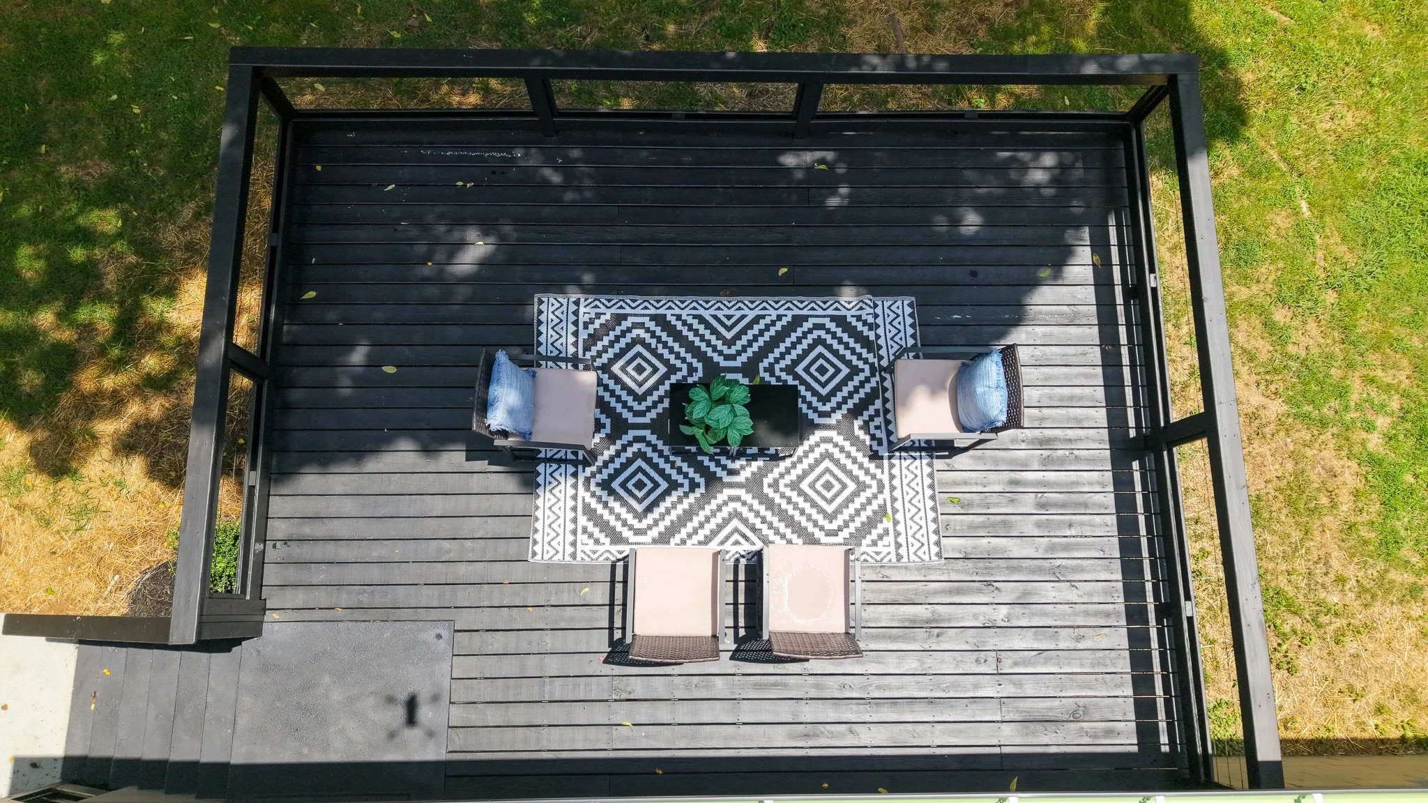 Aerial view of a black wooden deck.