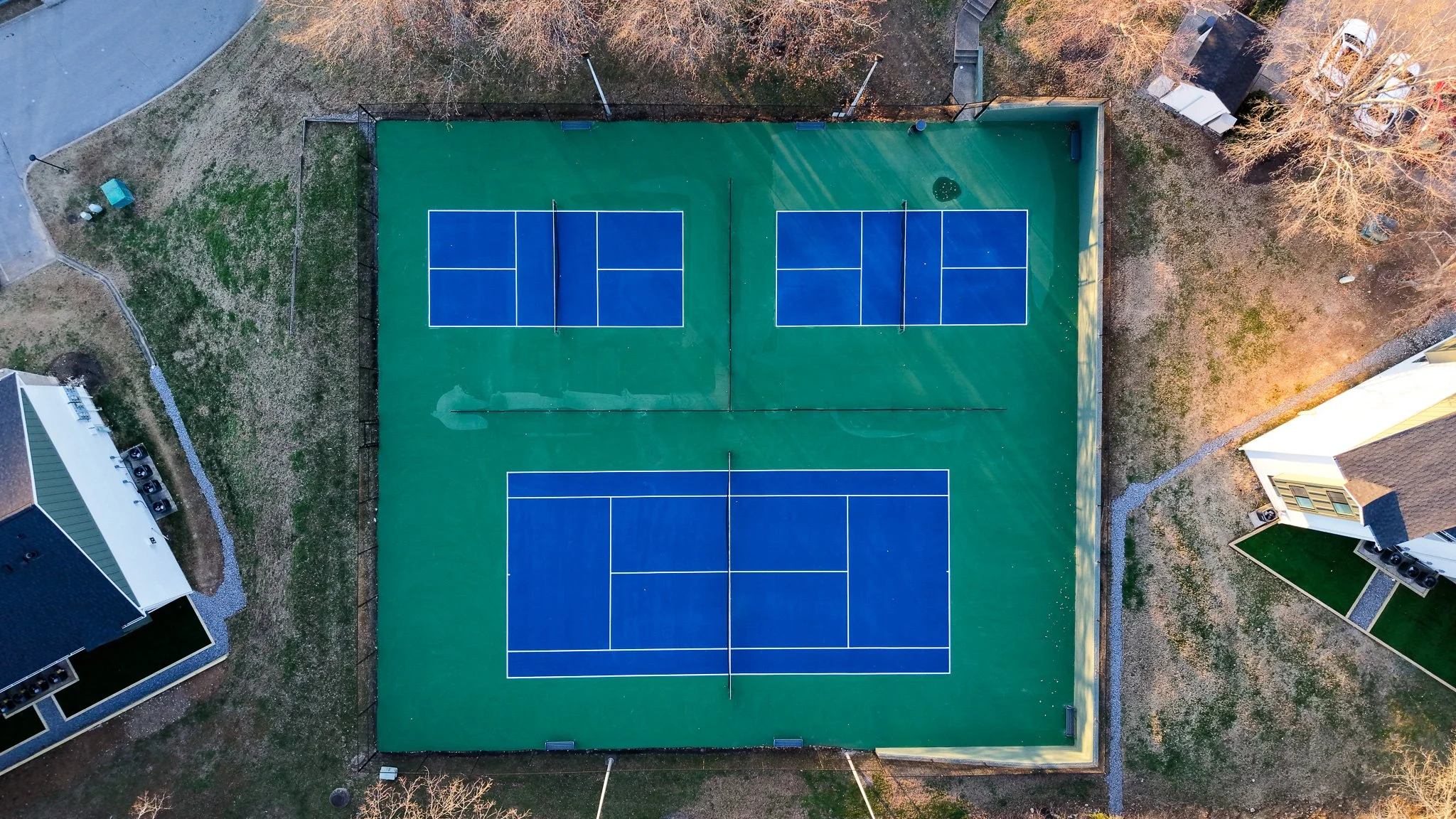An aerial view of a tennis court.