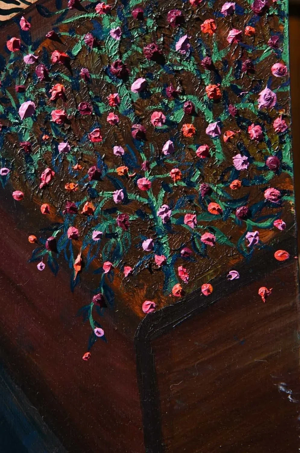 A painting of a potted plant with pink, orange, and purple flowers and green leaves on textured brown and black background.