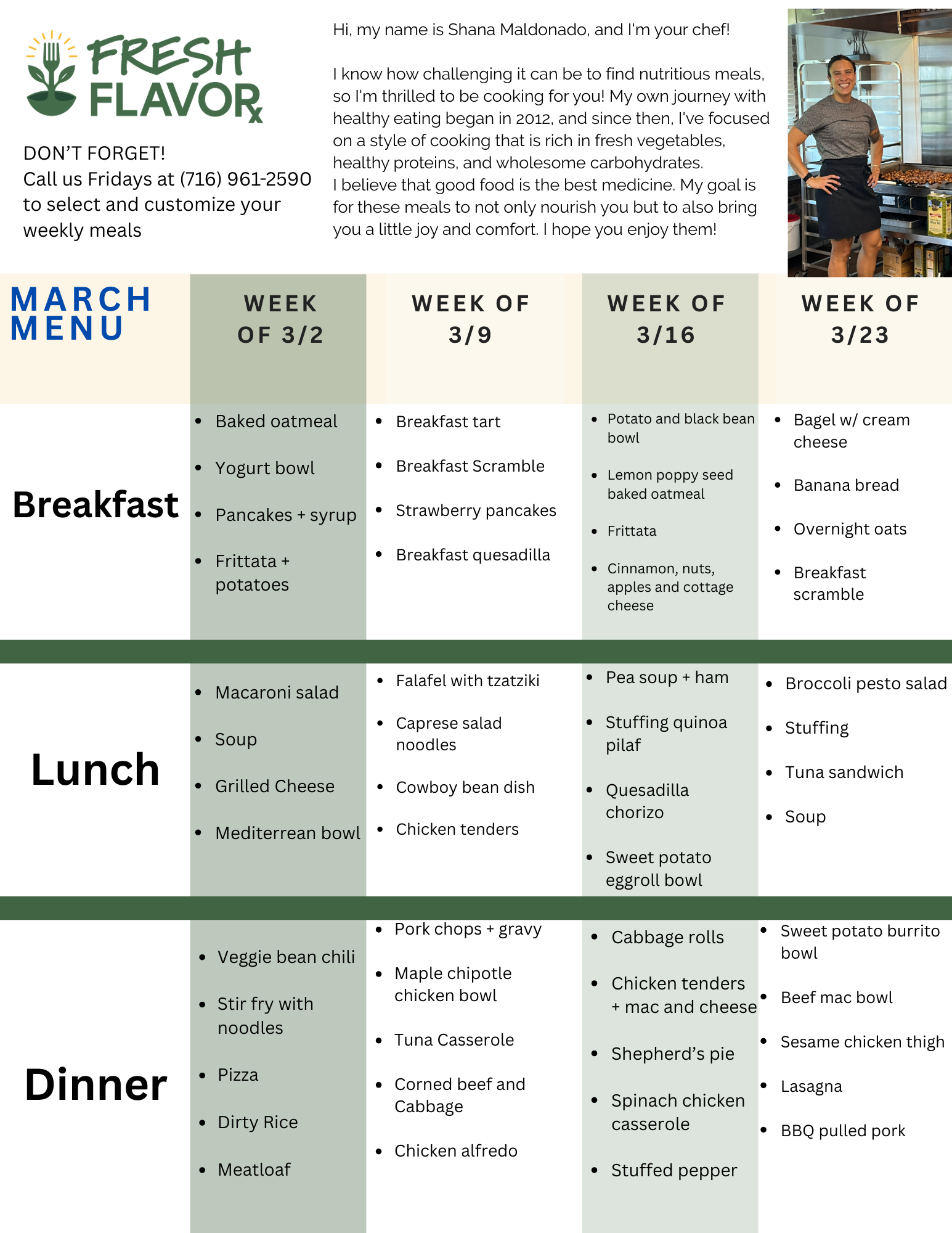 A cheerful woman in a gray t-shirt and black apron preparing food in a commercial kitchen.