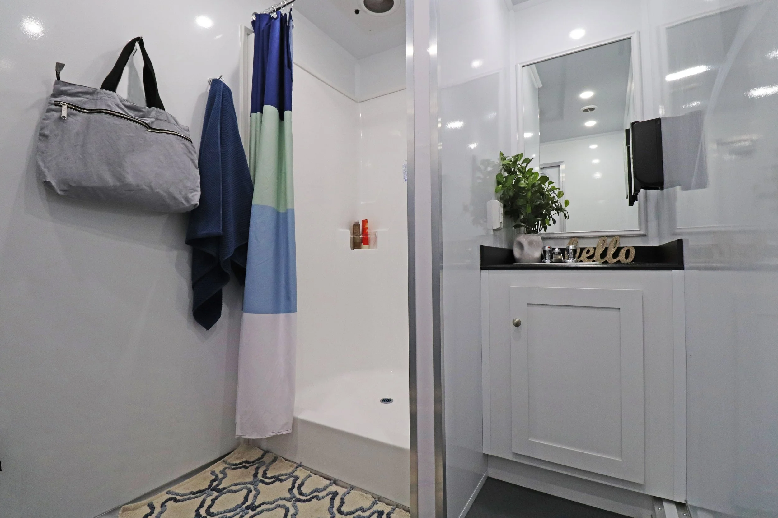 Shower and sink inside restroom facility