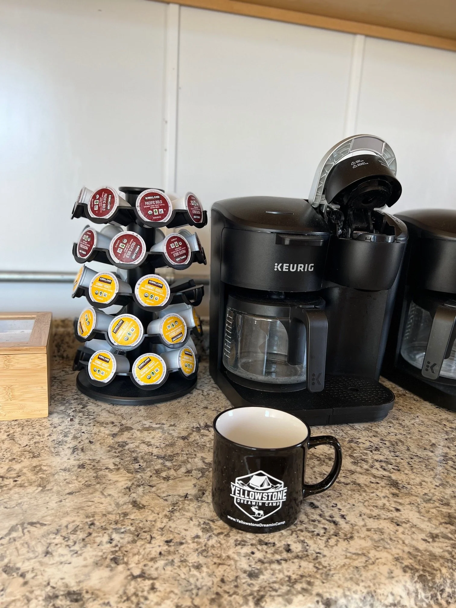 Coffee machine on a counter with coffee pods beside it
