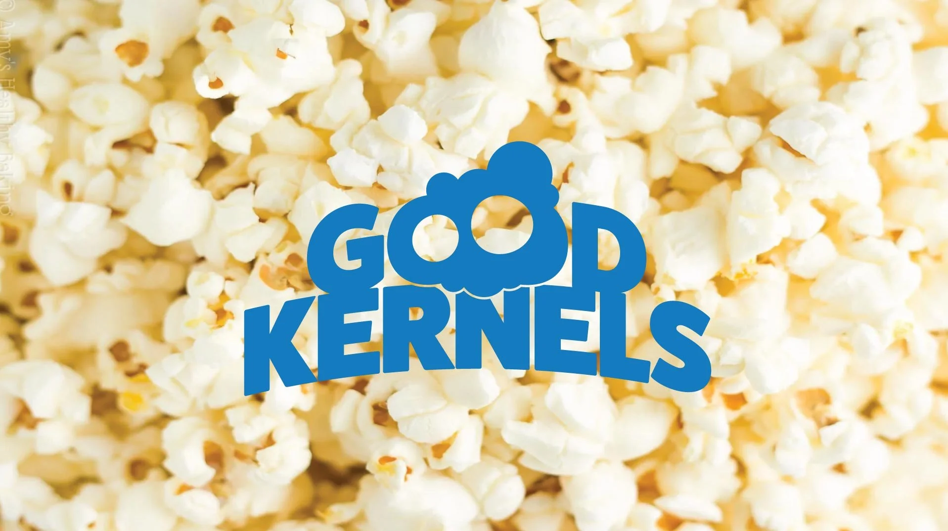Close-up of popped popcorn with a blue text overlay that reads "Good Kernels".
