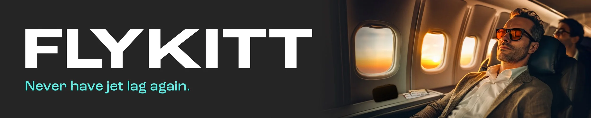 Man wearing sunglasses sitting in airplane window seat during sunset, with other passengers nearby.