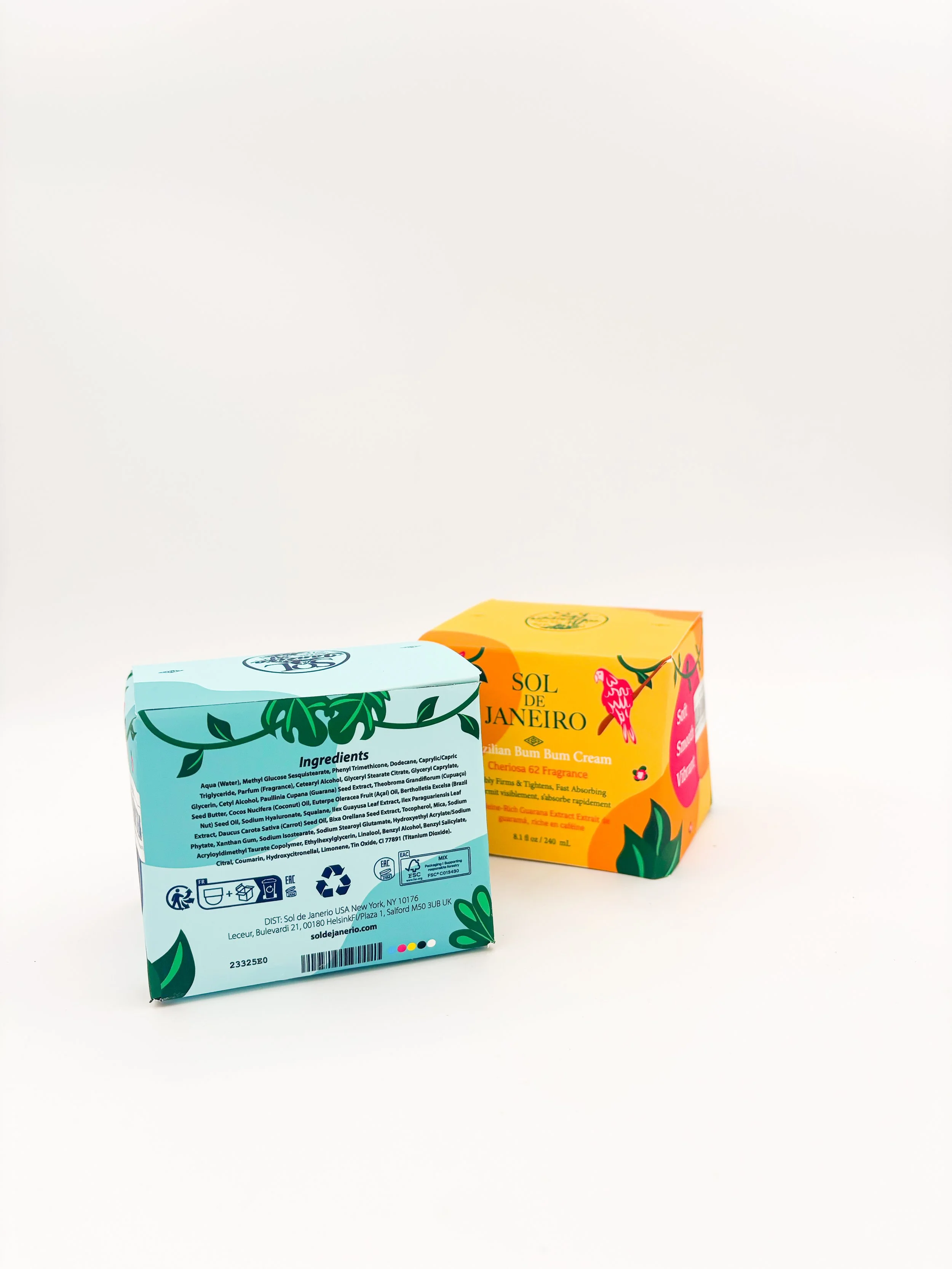 Colorful boxes of Sol de Janeiro Bum Bum Cream with tropical leaf and flower designs on a white background.
