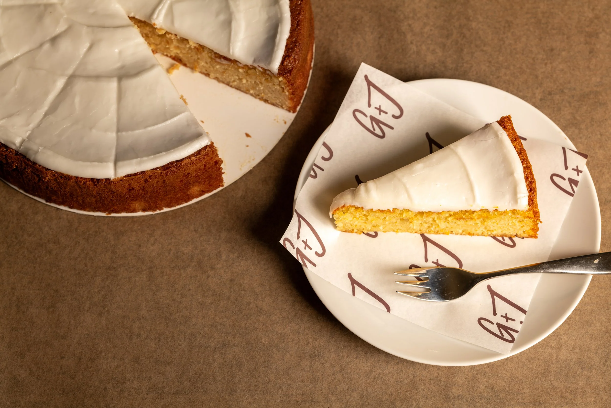 Orange and Almond cake with orange glazed icing. Made without gluten containing ingredients. 10" cake, serves 12-16.