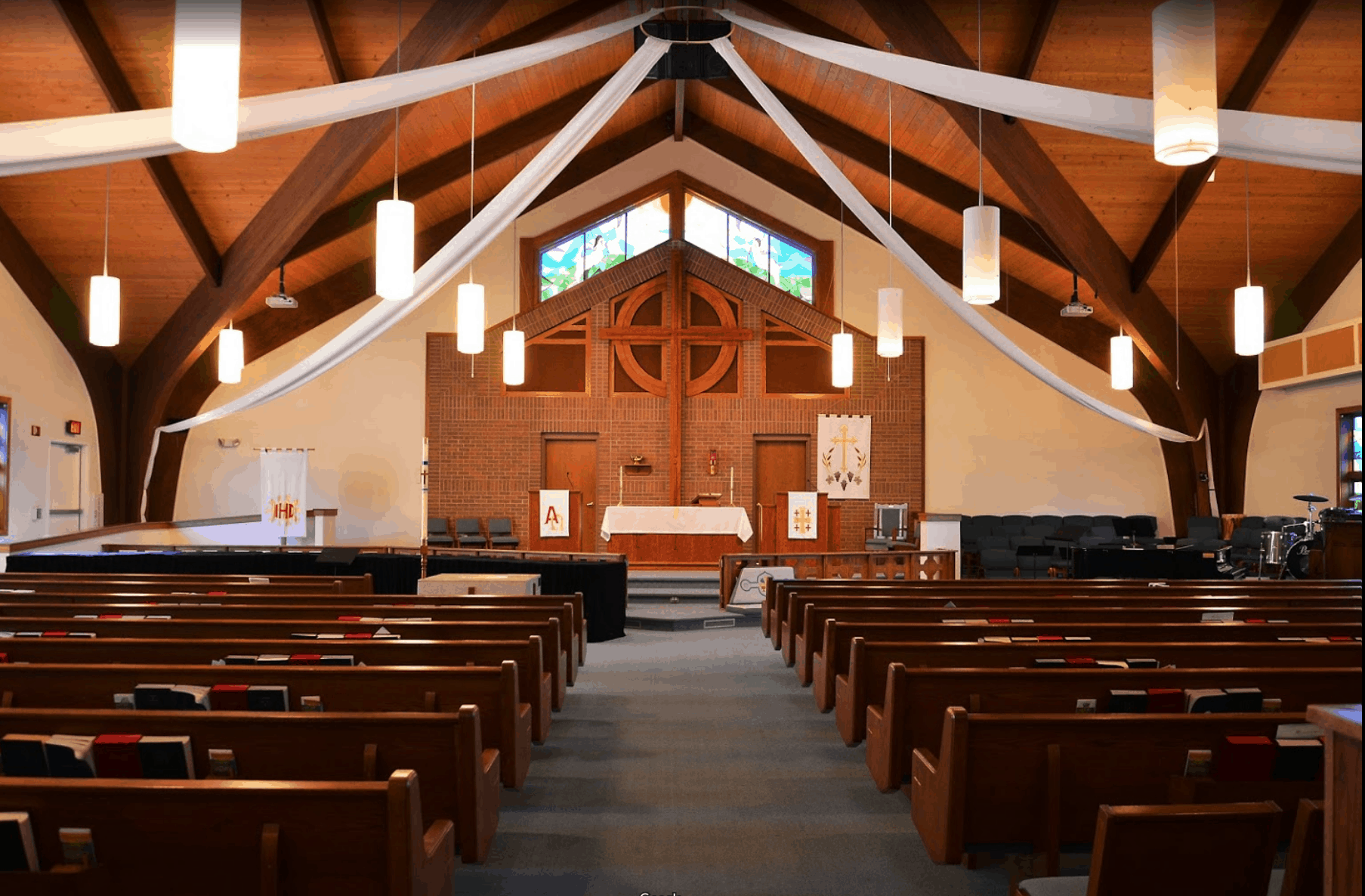 Sanctuary of Christ Lutheran church showing the altar and rows of pews