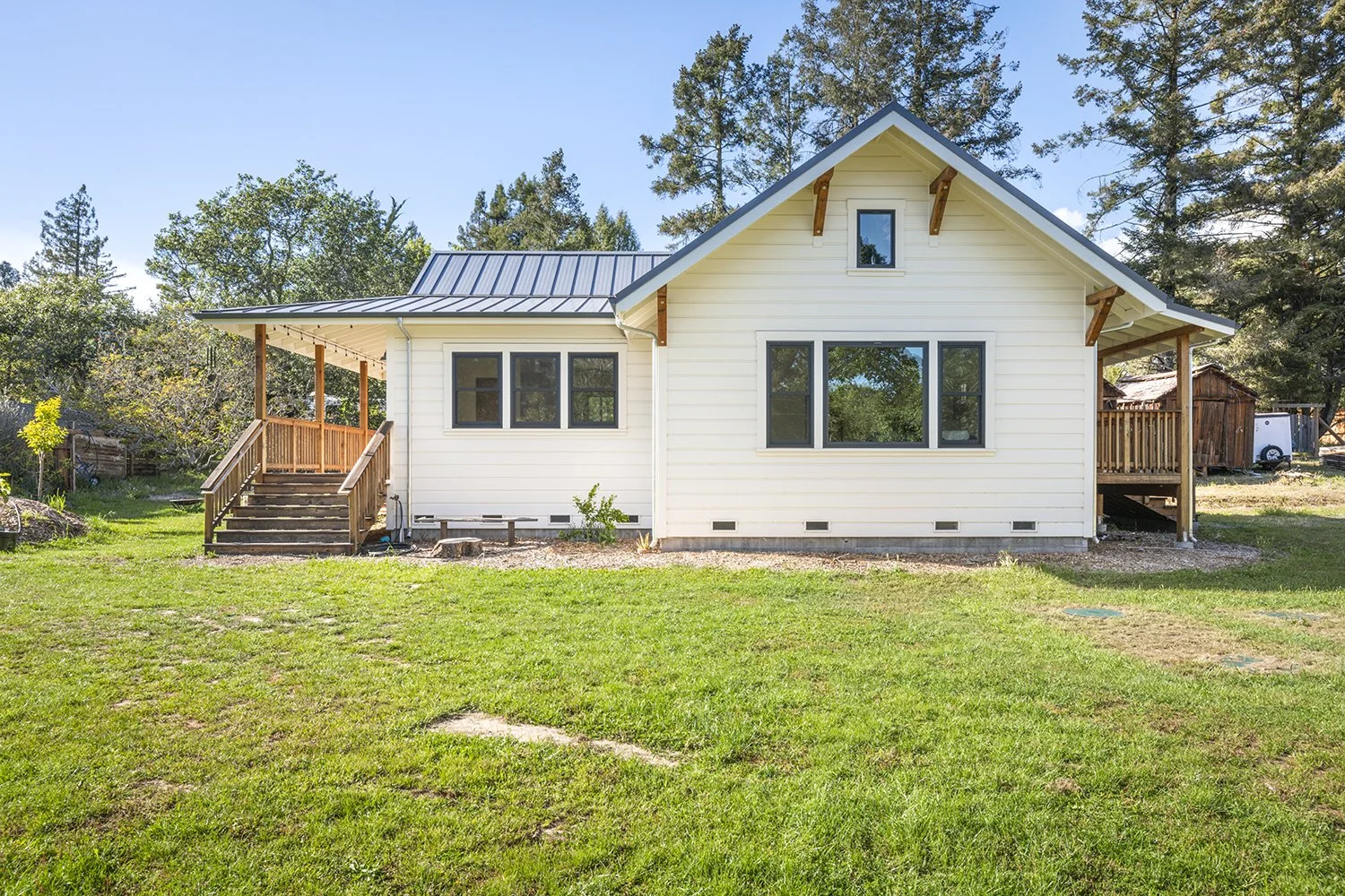 Located in Santa Rosa. Modern Farmhouse style with wrap around porch and vaulted ceilings