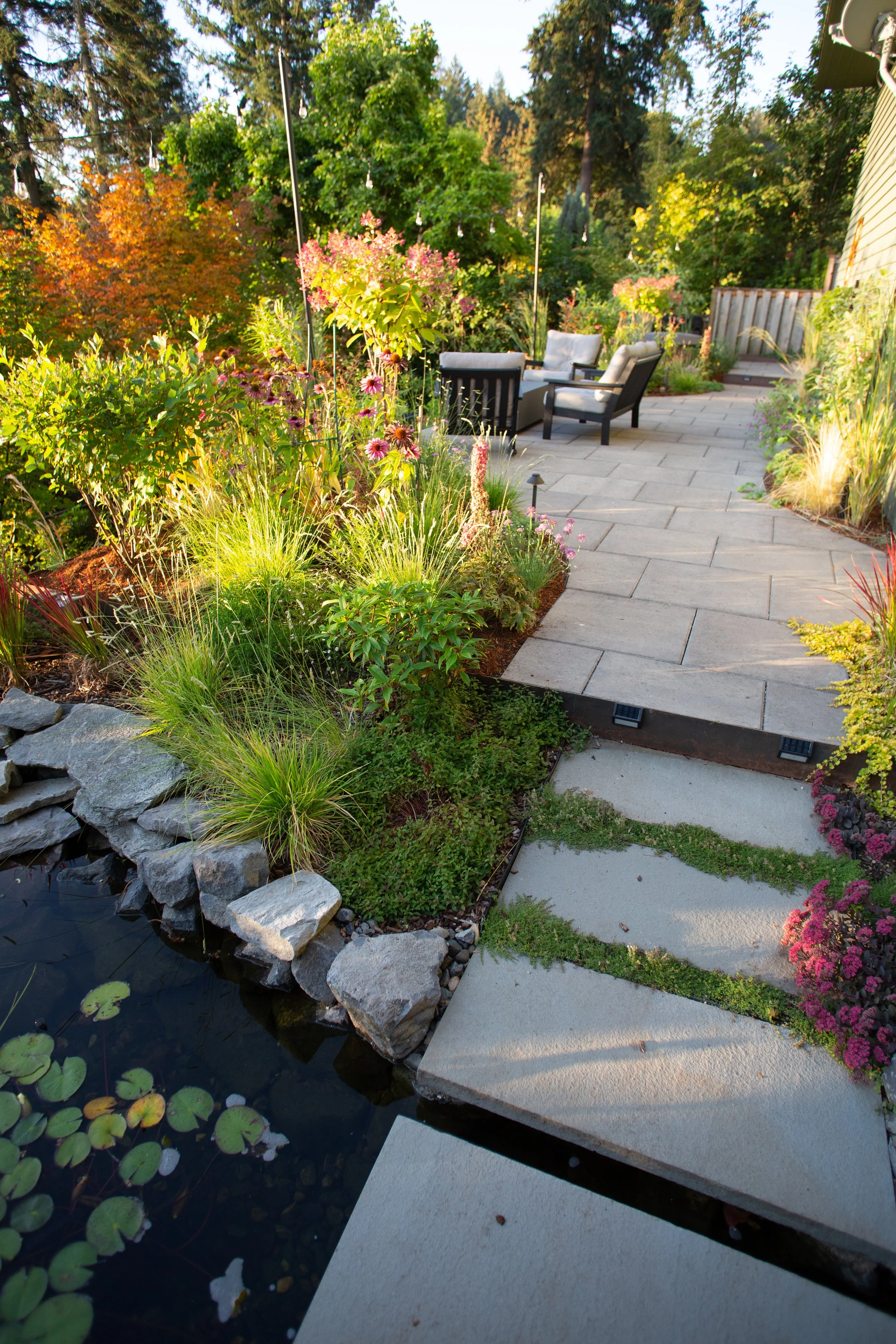 Bluestone flagstone and dry creek bed naturalistic garden design by Garden Riot Designs