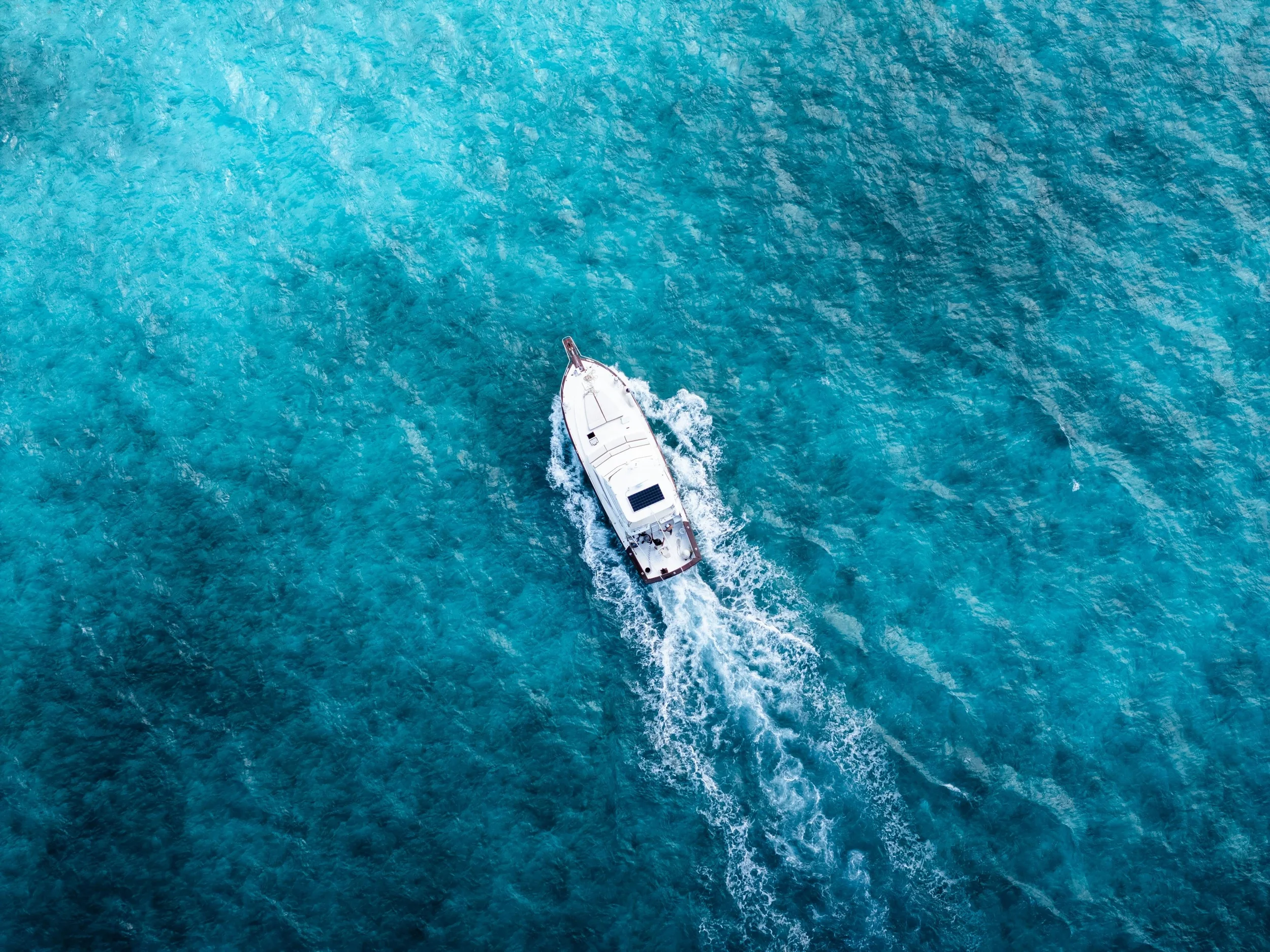 Recreational boat on the water near a scenic coastline