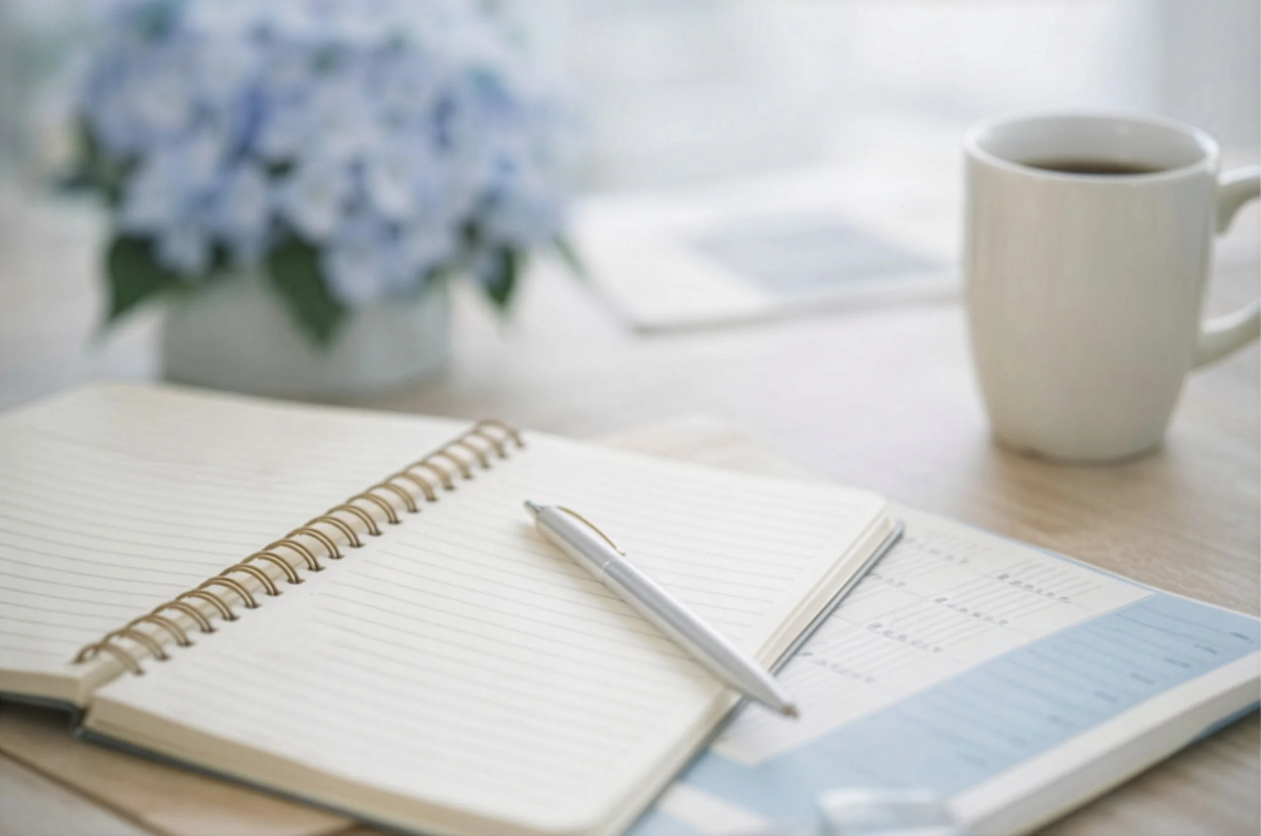 Notebook and planning materials used for thoughtful organizational strategy development