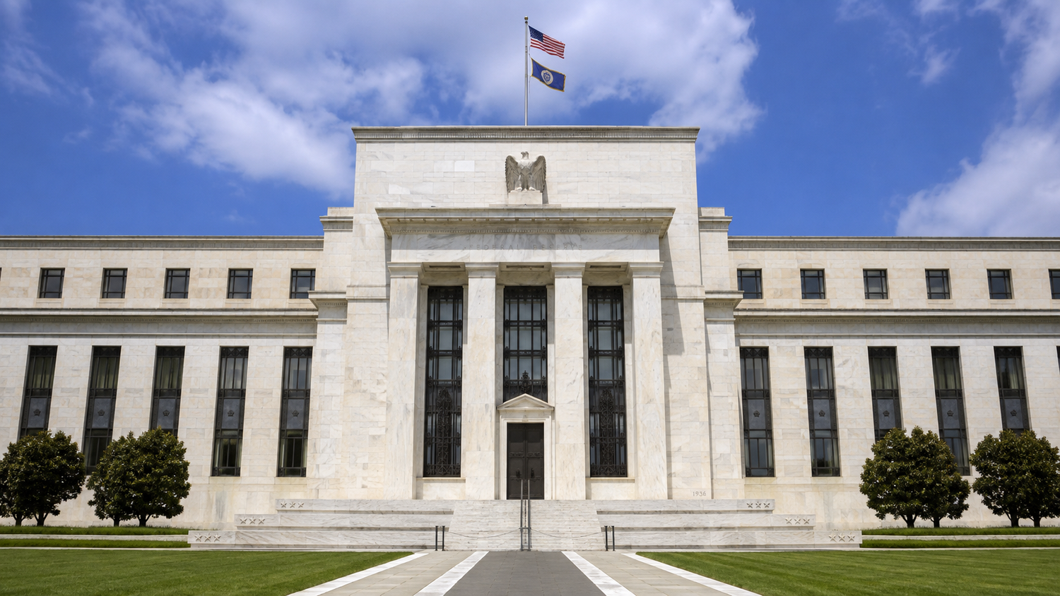 The Federal Reserve building in Washington, D.C., under a blue sky