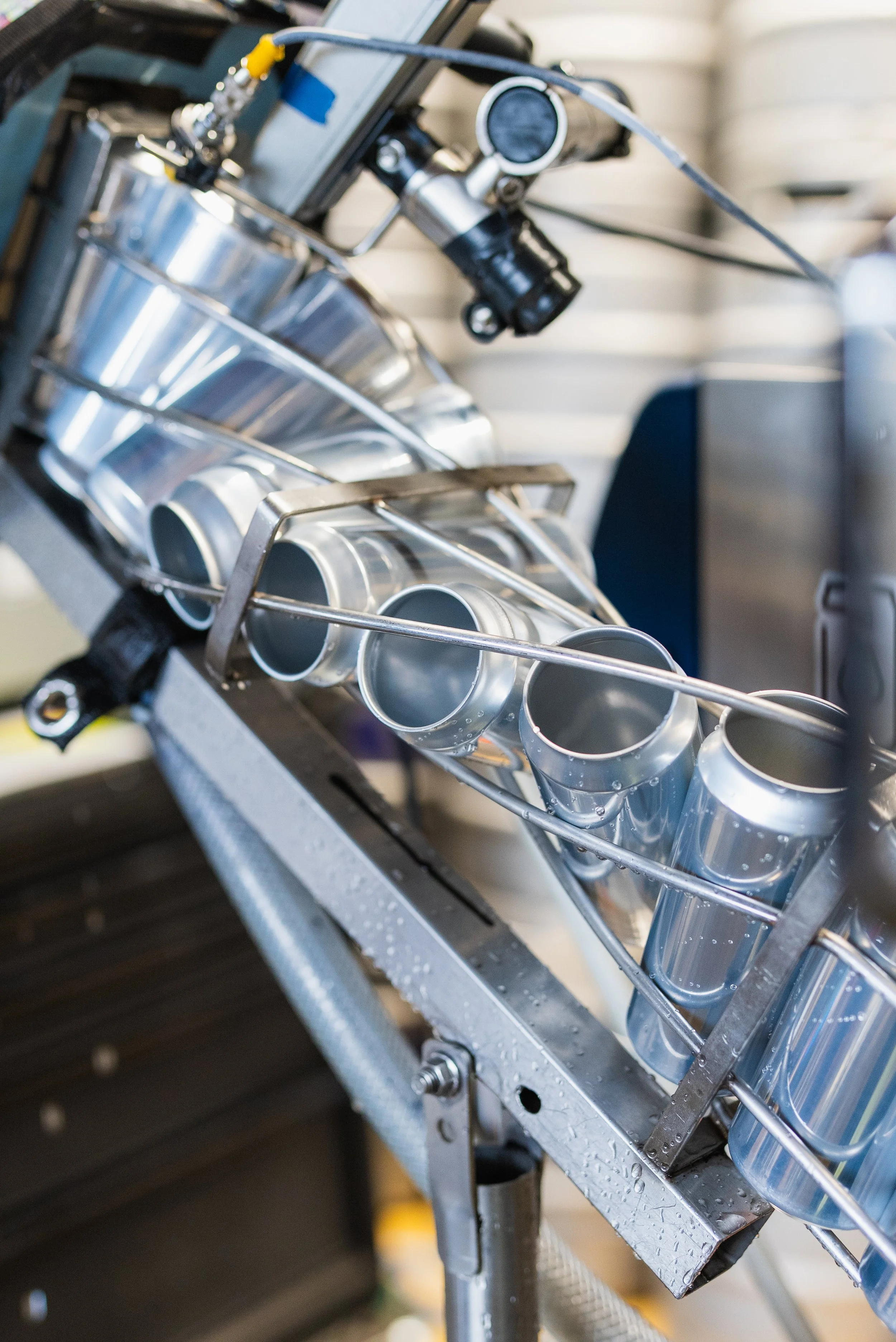 Close-up of a metallic rocket fuel injector or nozzle assembly during manufacturing or testing.