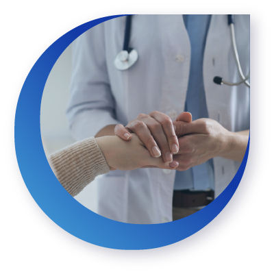 A doctor holding a patient's hand in a compassionate gesture, with a stethoscope around the doctor's neck.