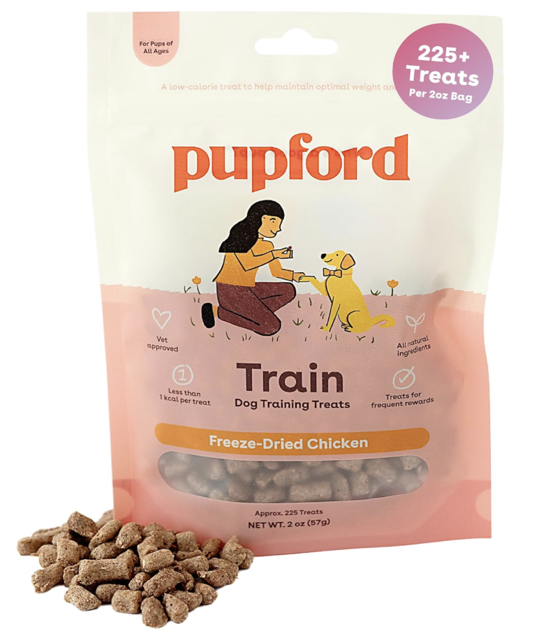 Pupford dog training treats package with a transparent window showing small, dried chicken pieces and some treats outside the bag. The package has illustration of a woman and a dog, and labels indicating it contains 225+ treats, is vet approved, made of all-natural ingredients, and is suitable for dogs of all ages.