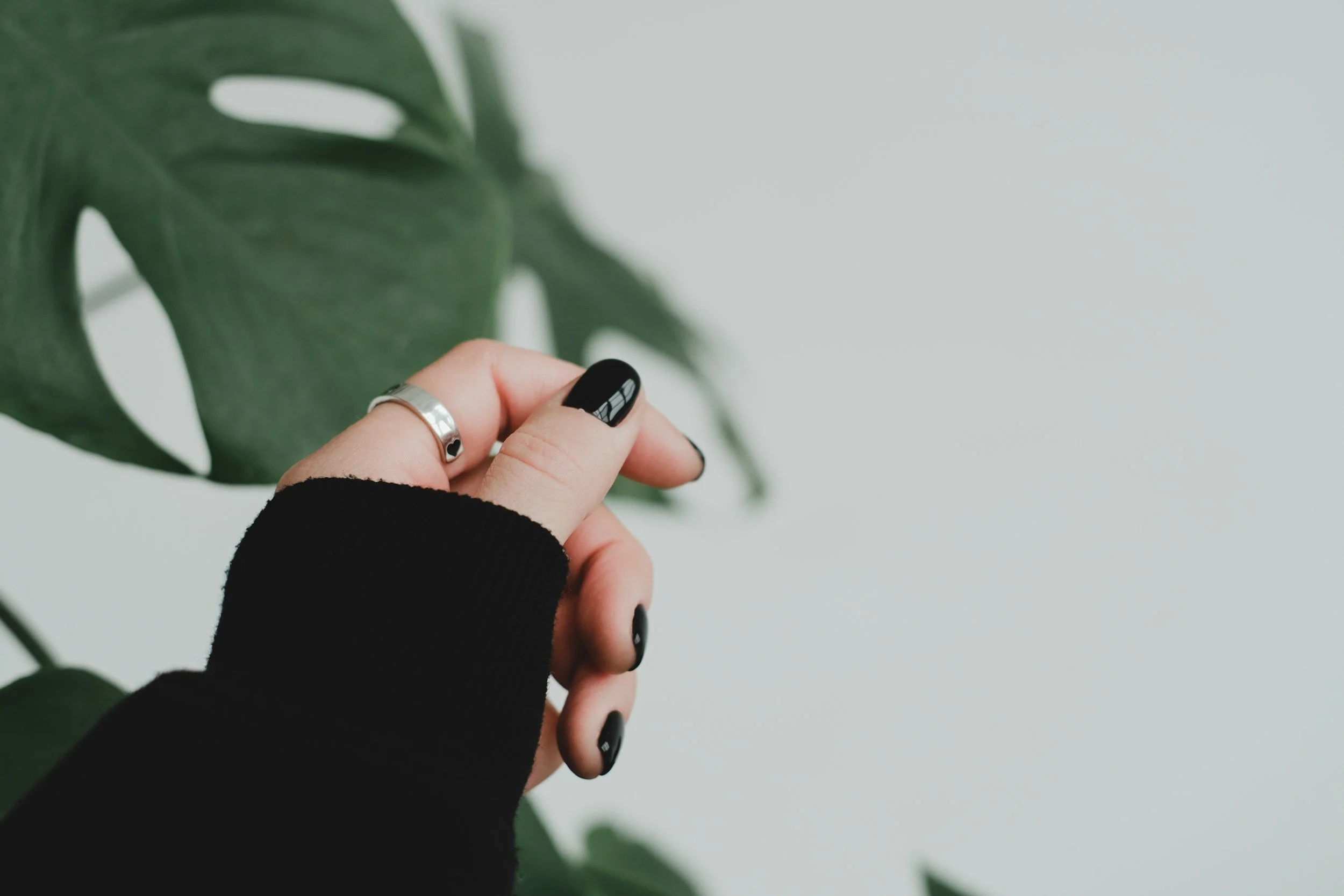 simple silver band on woman's hand
