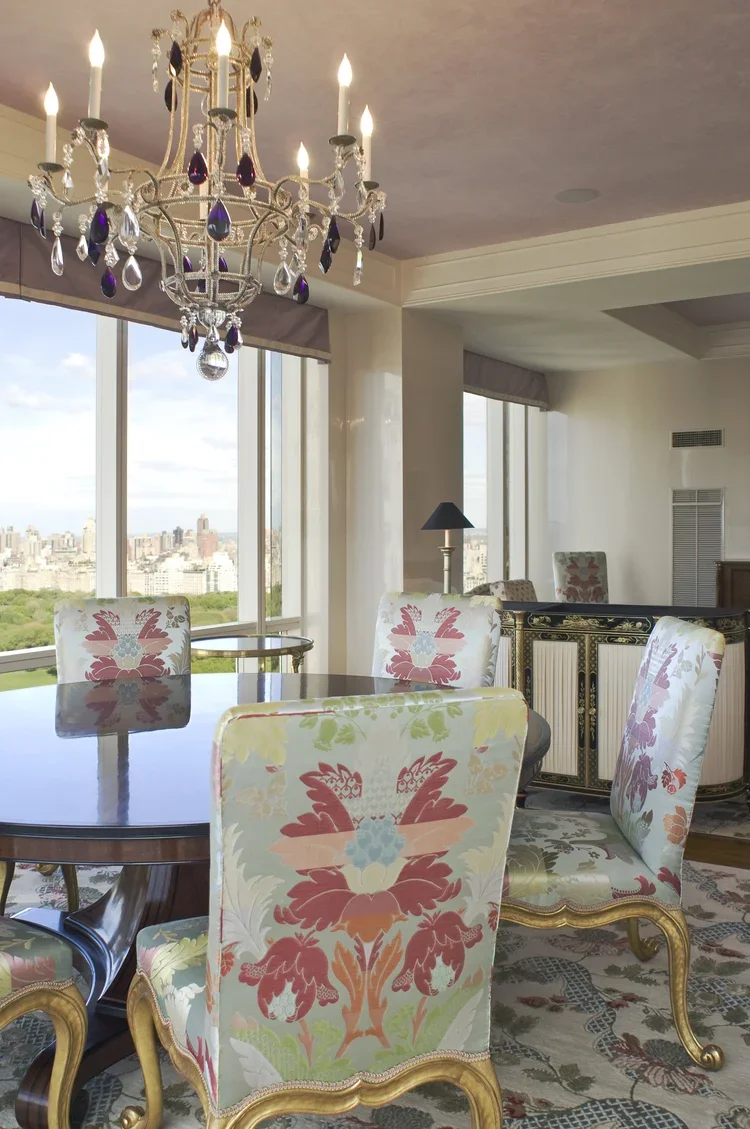 Dining Area - 
Gilded dining chairs under a rock crystal chandelier enhanced by Central Park views
