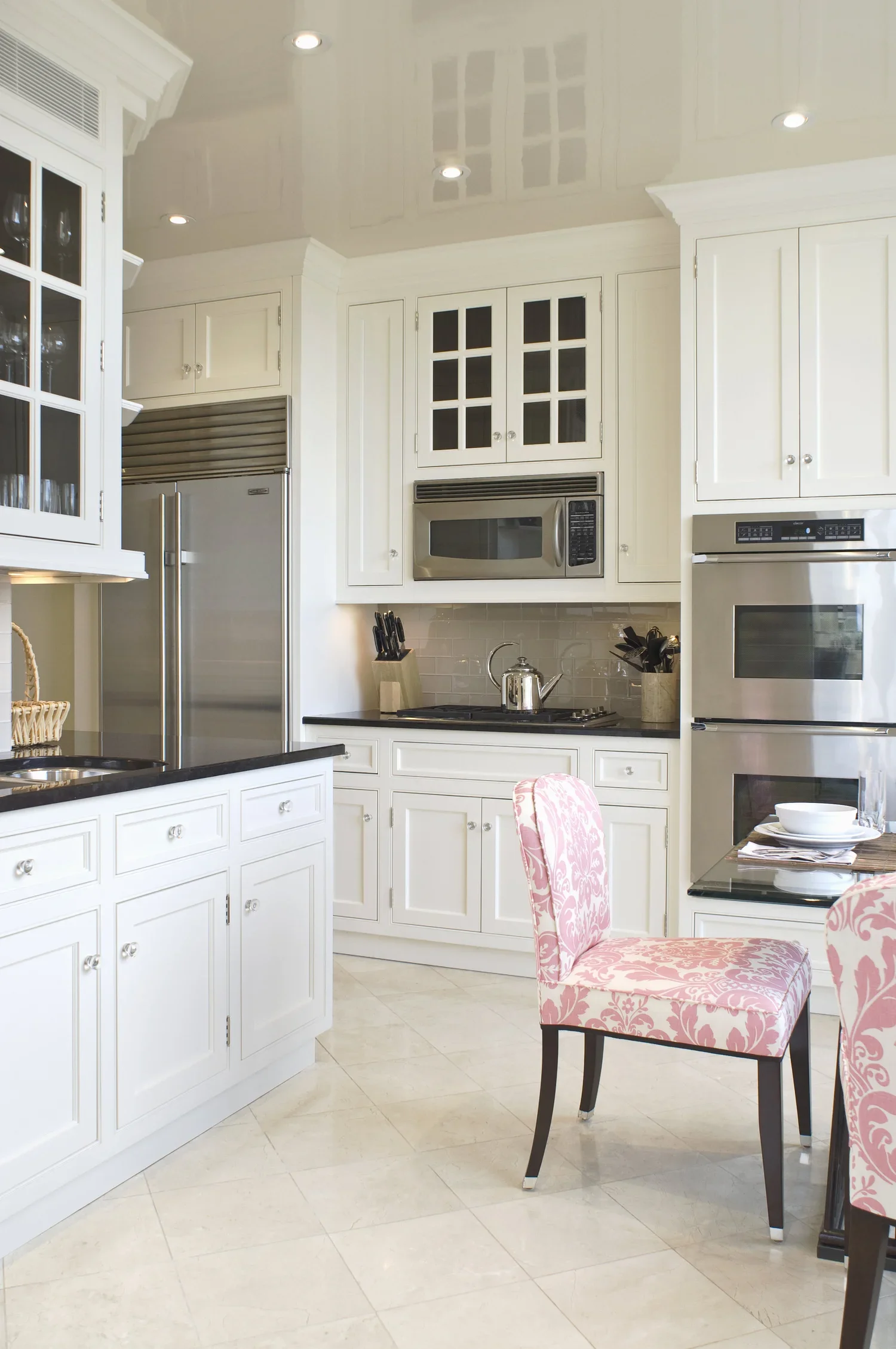 Pink and brown accents in a cream and chocolate Kitchen
