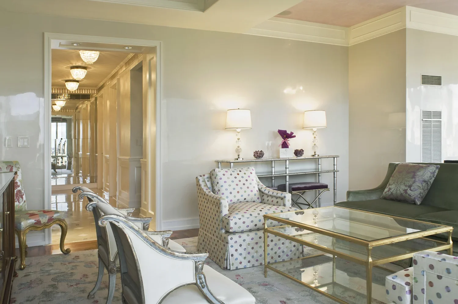 Cream lacquer walls, Swedish chairs and a custom floral silk rug