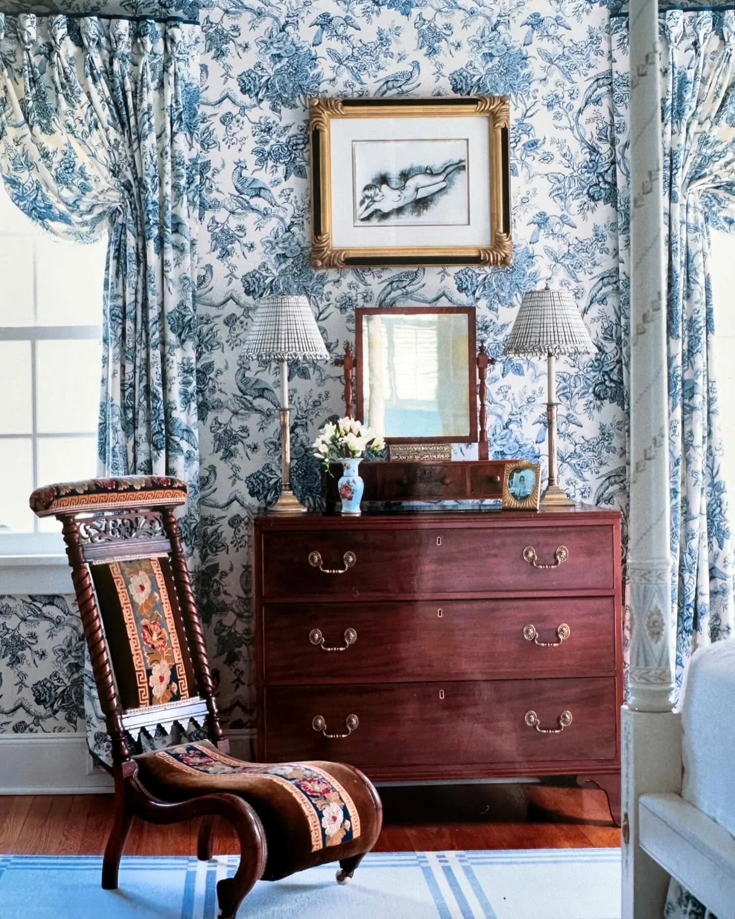 Another corner of my toile bedroom featuring a 19th century slipper chair covered in its original needlepoint #blueandwhitedecor #antiques #classicdecor