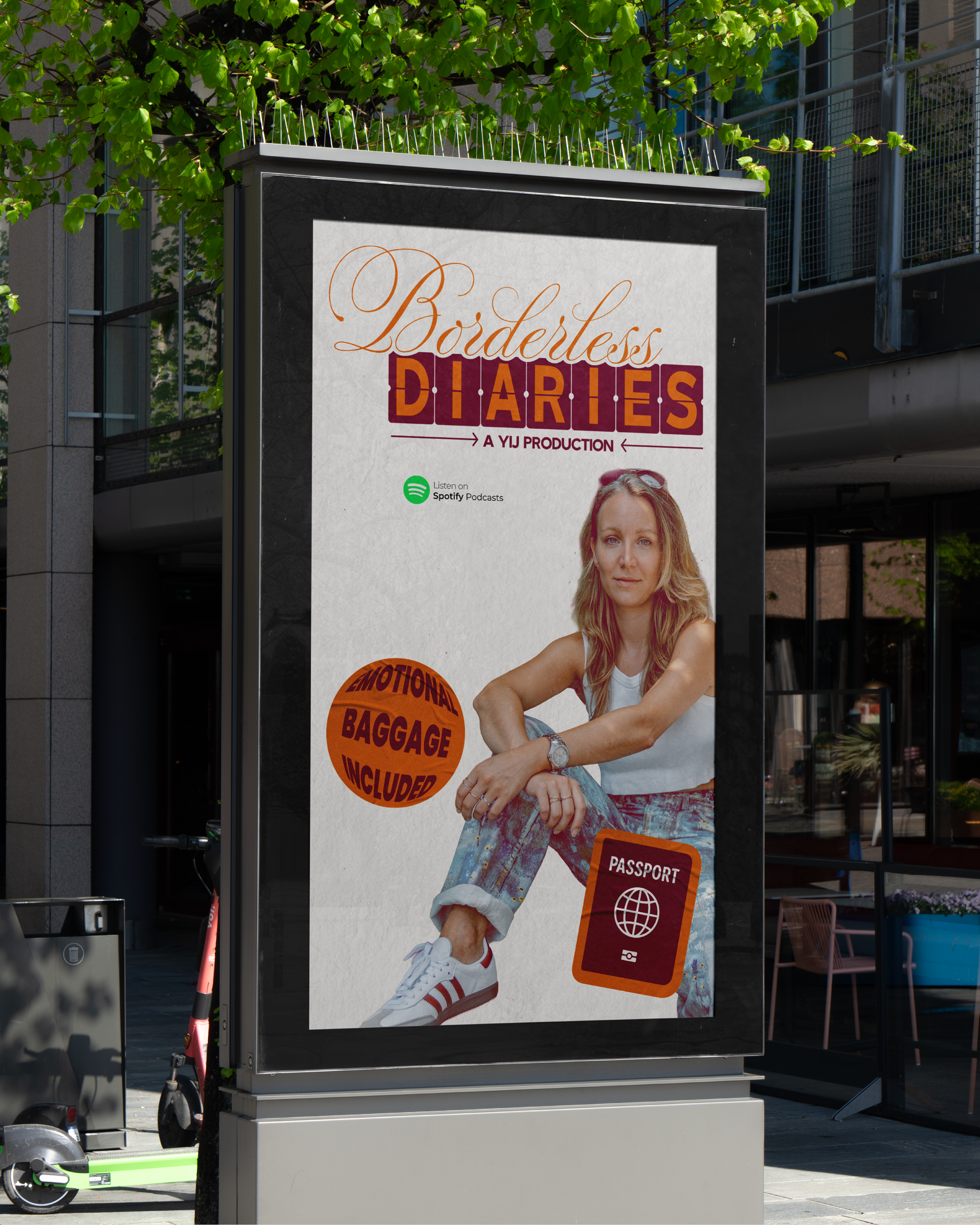 Poster advertising a podcast titled 'Borderless Diaries,' featuring a woman sitting with her arms crossed, wearing a white top and colorful jeans, with an orange circular badge claiming 'Emotional Baggage Included,' and an icon of a passport, promoting listening on Spotify.