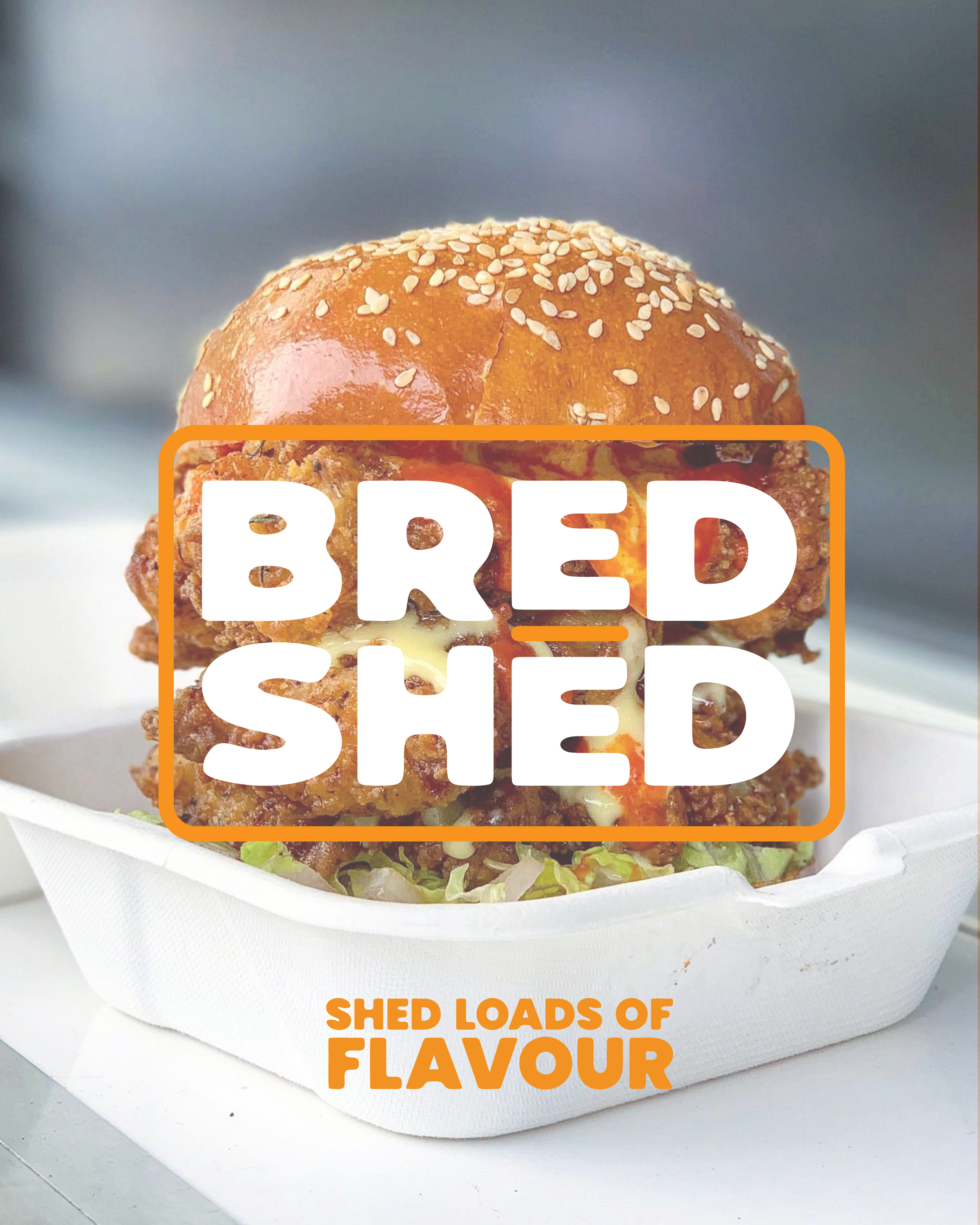 A fried chicken sandwich with a sesame seed bun, lettuce, and cheese, in a white takeout container, with overlay text 'BRED SHED' and 'SHED LOADS OF FLAVOUR'.