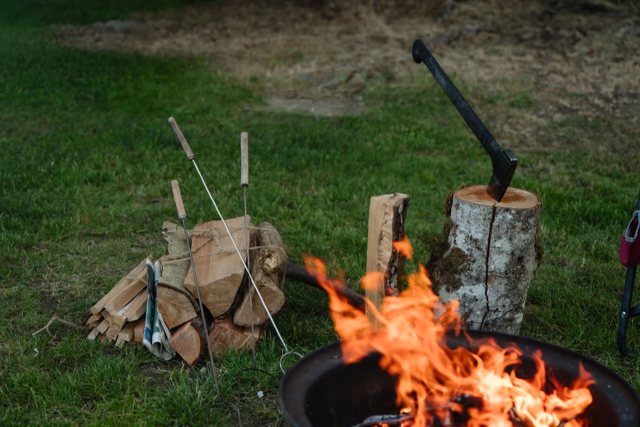 Marshmallows being toasted over a campfire.