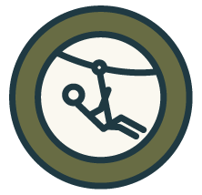 Person in a diving suit underwater, holding onto a clock.