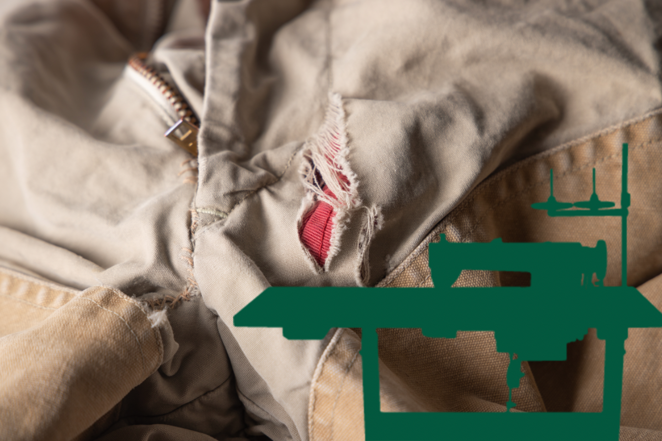Close-up of a torn and frayed beige and tan jacket with a red tag visible inside.