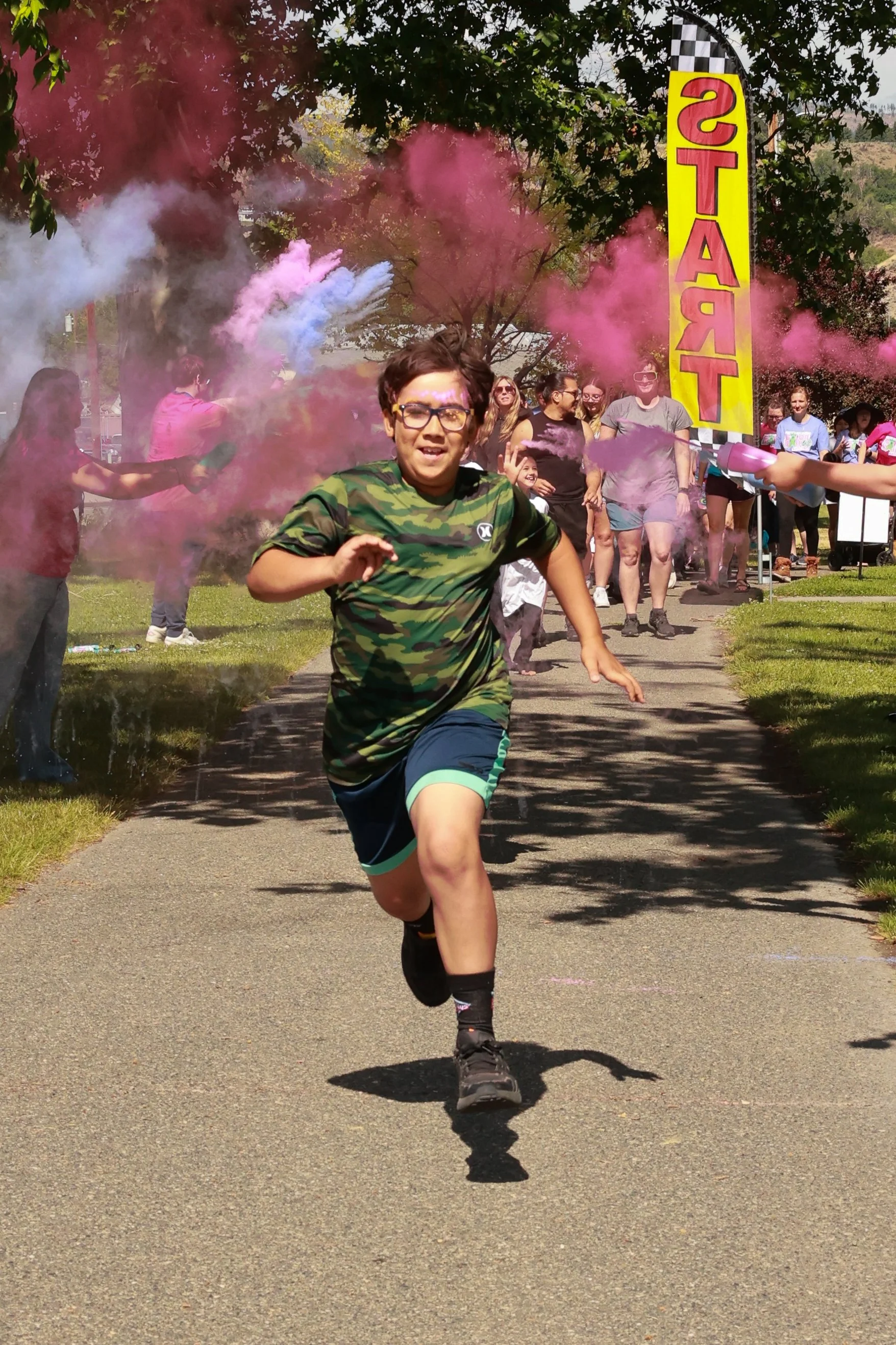 Photo of children running at OBHC's 2026 Color Walk.