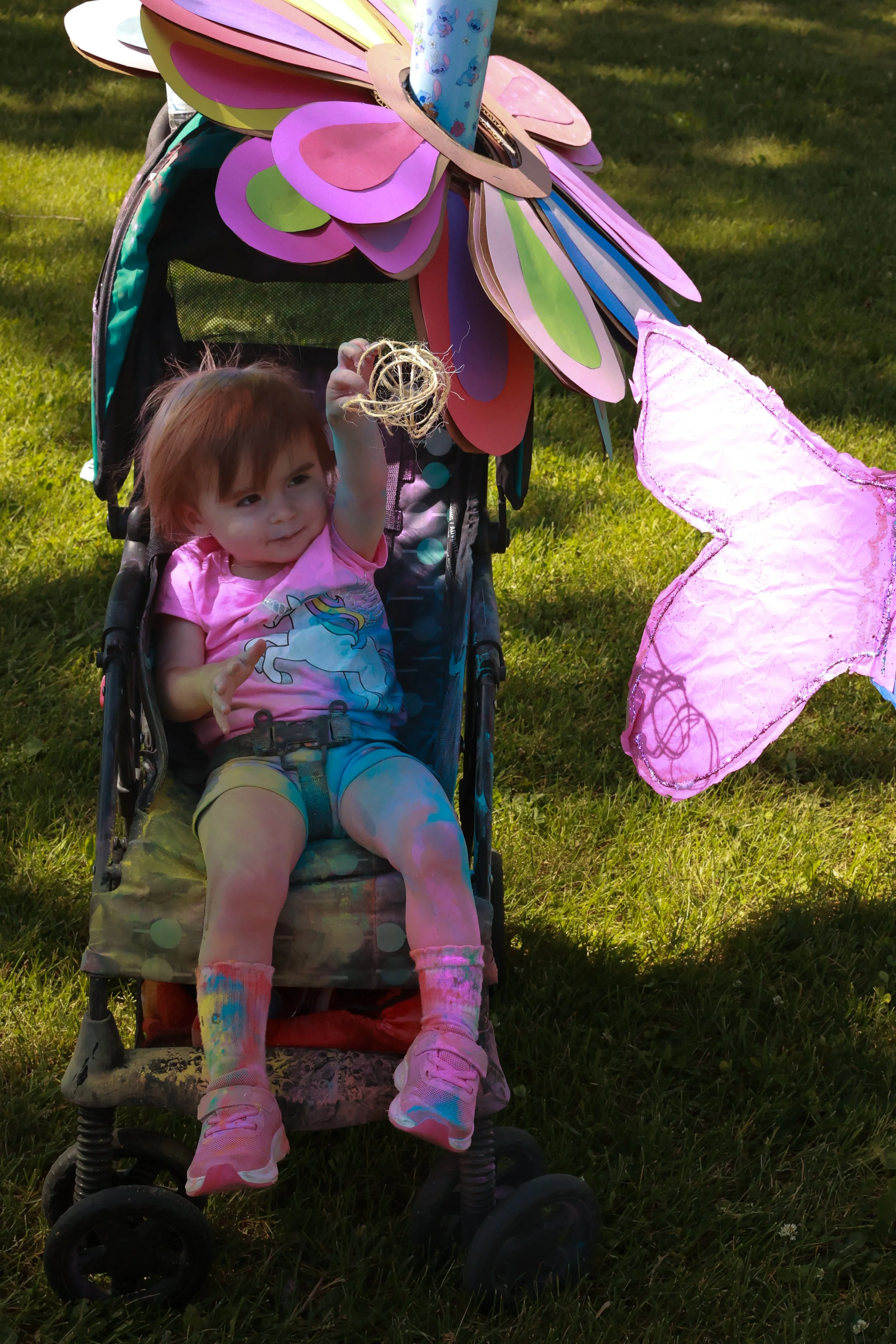 Photo of a young girl in her stroller at OBHC's 2026 Color Walk.