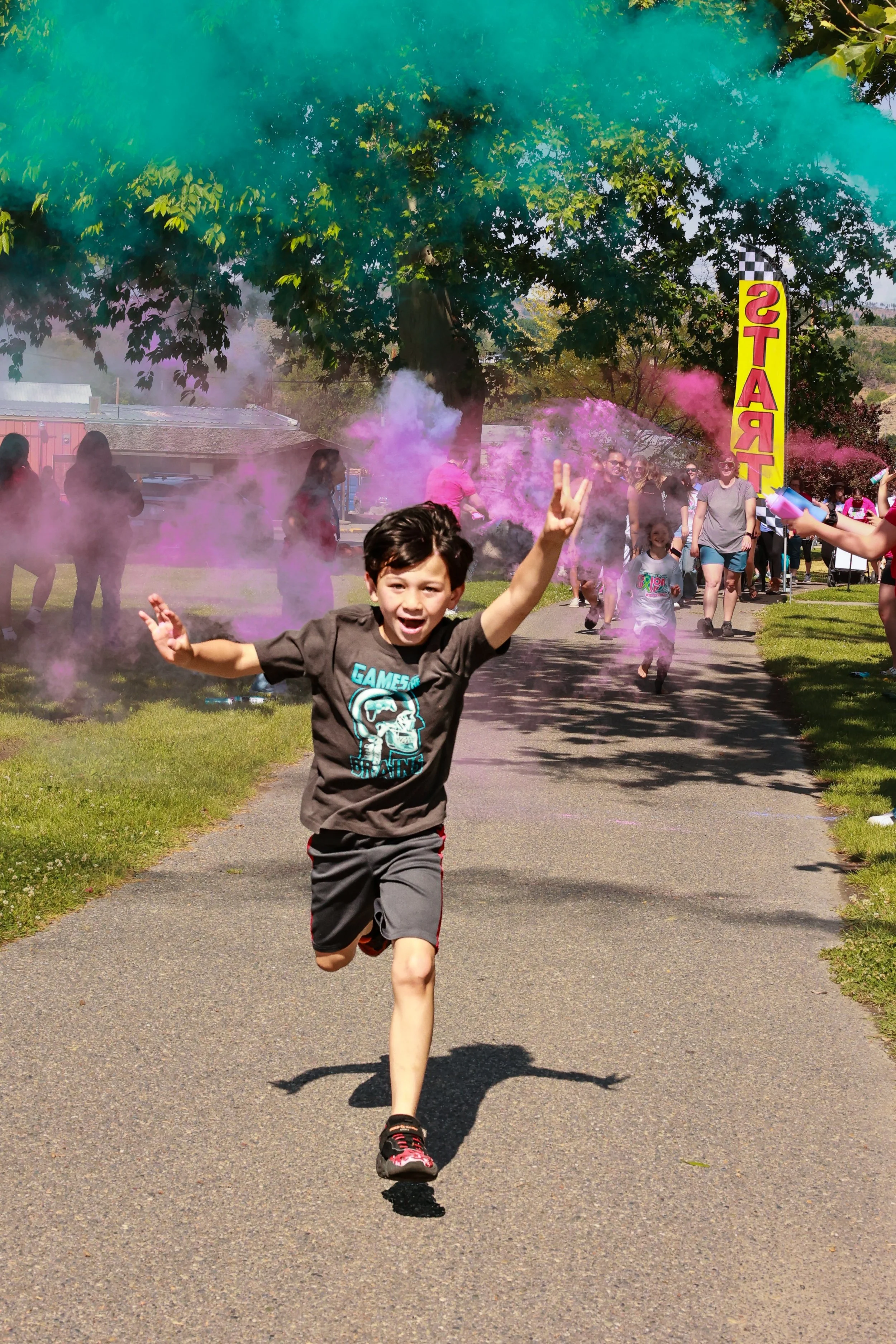 Photo of children running at OBHC's 2026 Color Walk.