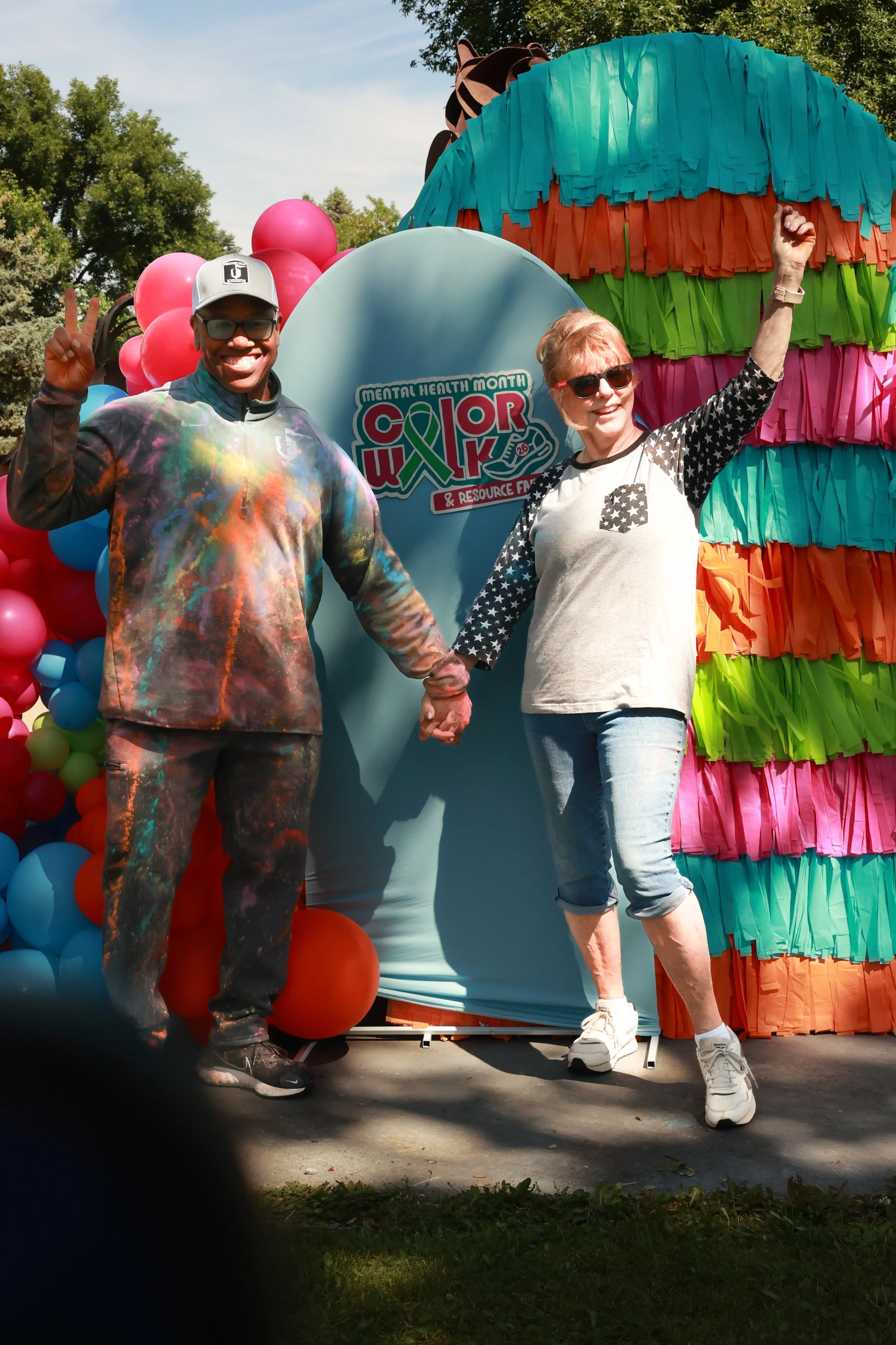 Photo of friends posing for a photo at OBHC's 2026 Color Walk.