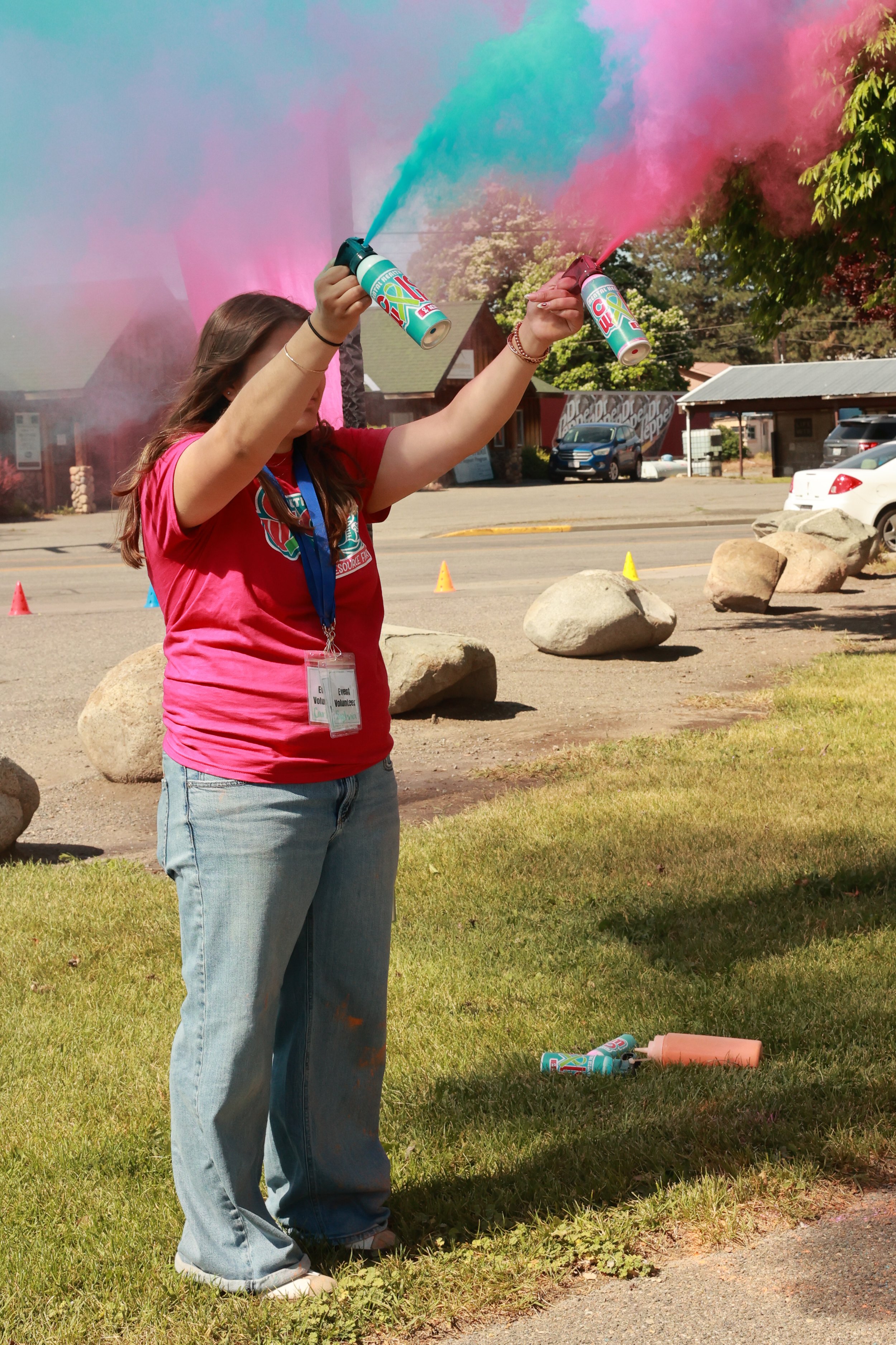 Photo of a teenager spraying color at OBHC's 2026 Color Walk.