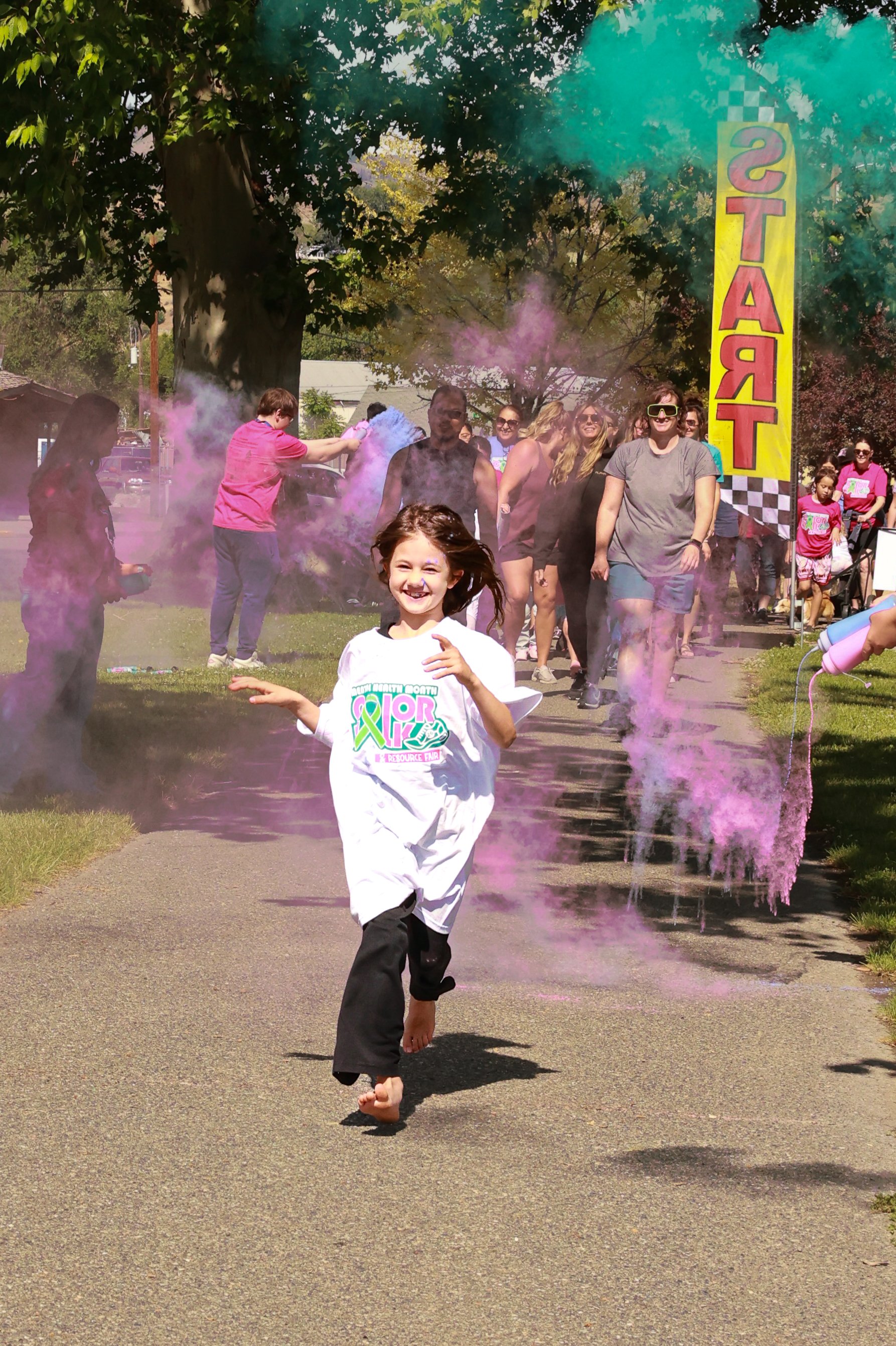 Photo of children running at OBHC's 2026 Color Walk.