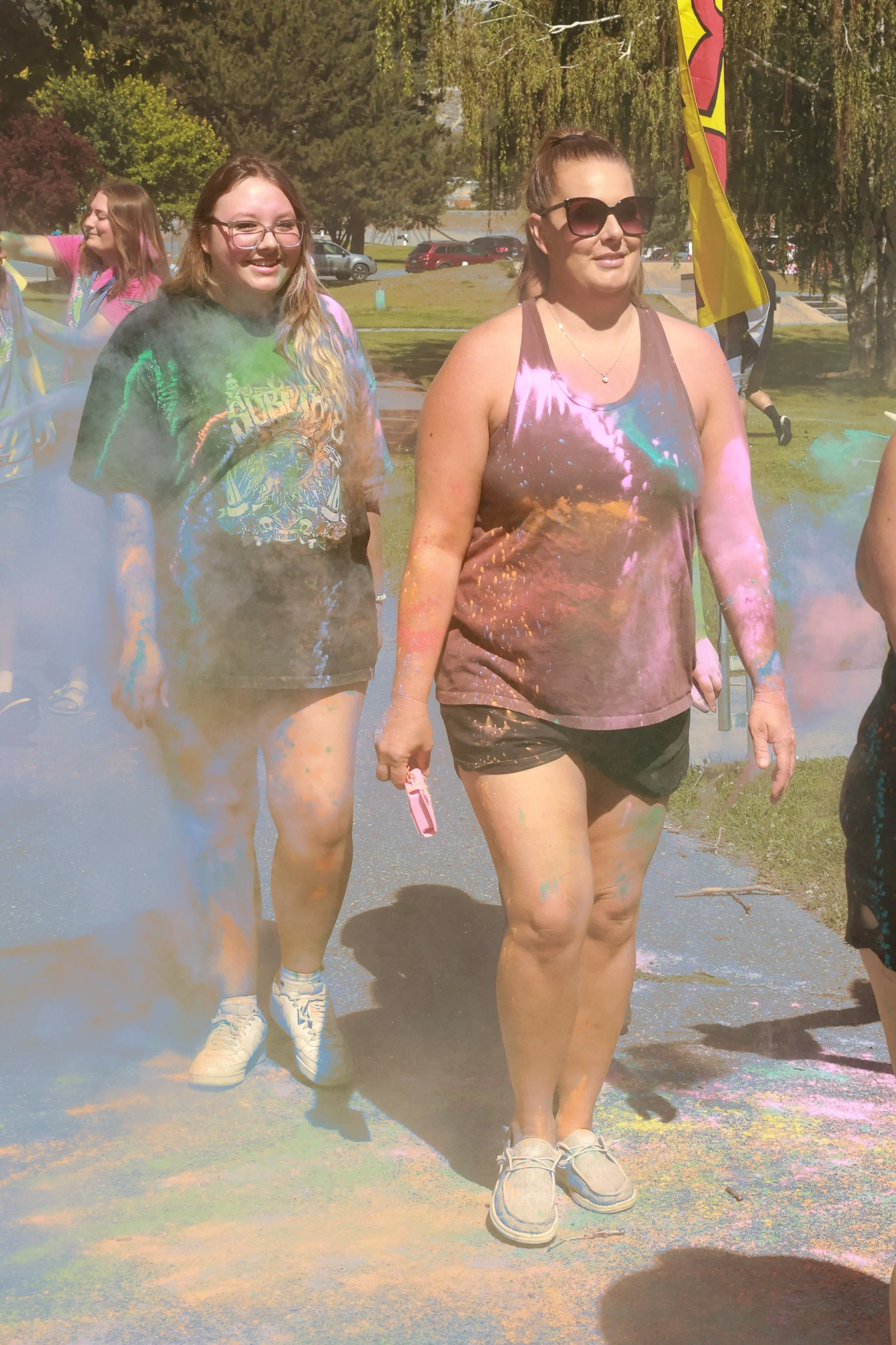 Photo of people being sprayed with color at OBHC's 2026 Color Walk.