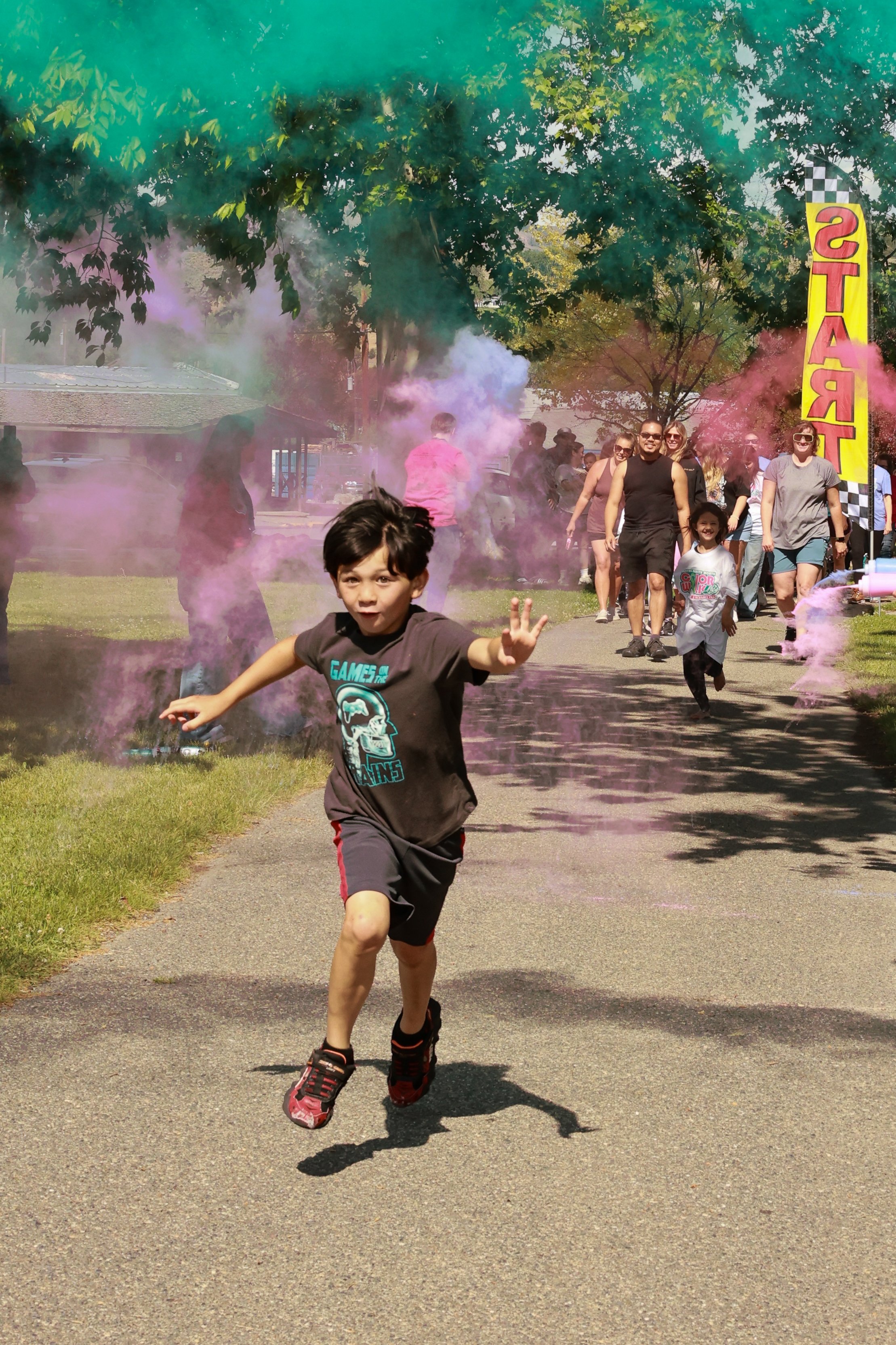Photo of children running at OBHC's 2026 Color Walk.