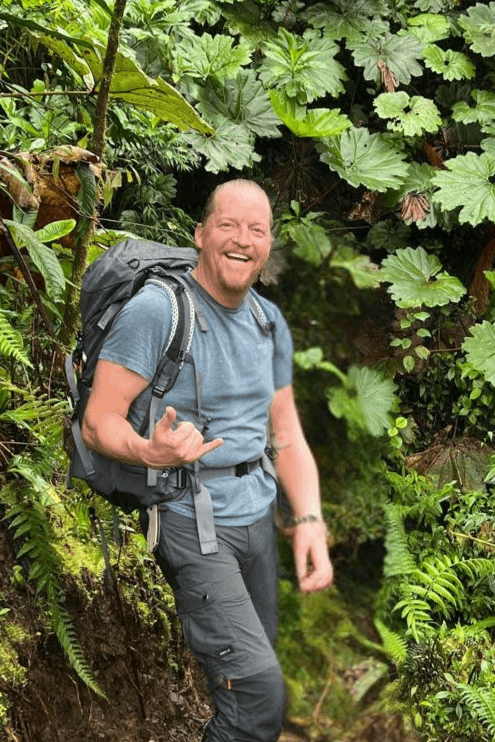 paul in the jungle with a backpack