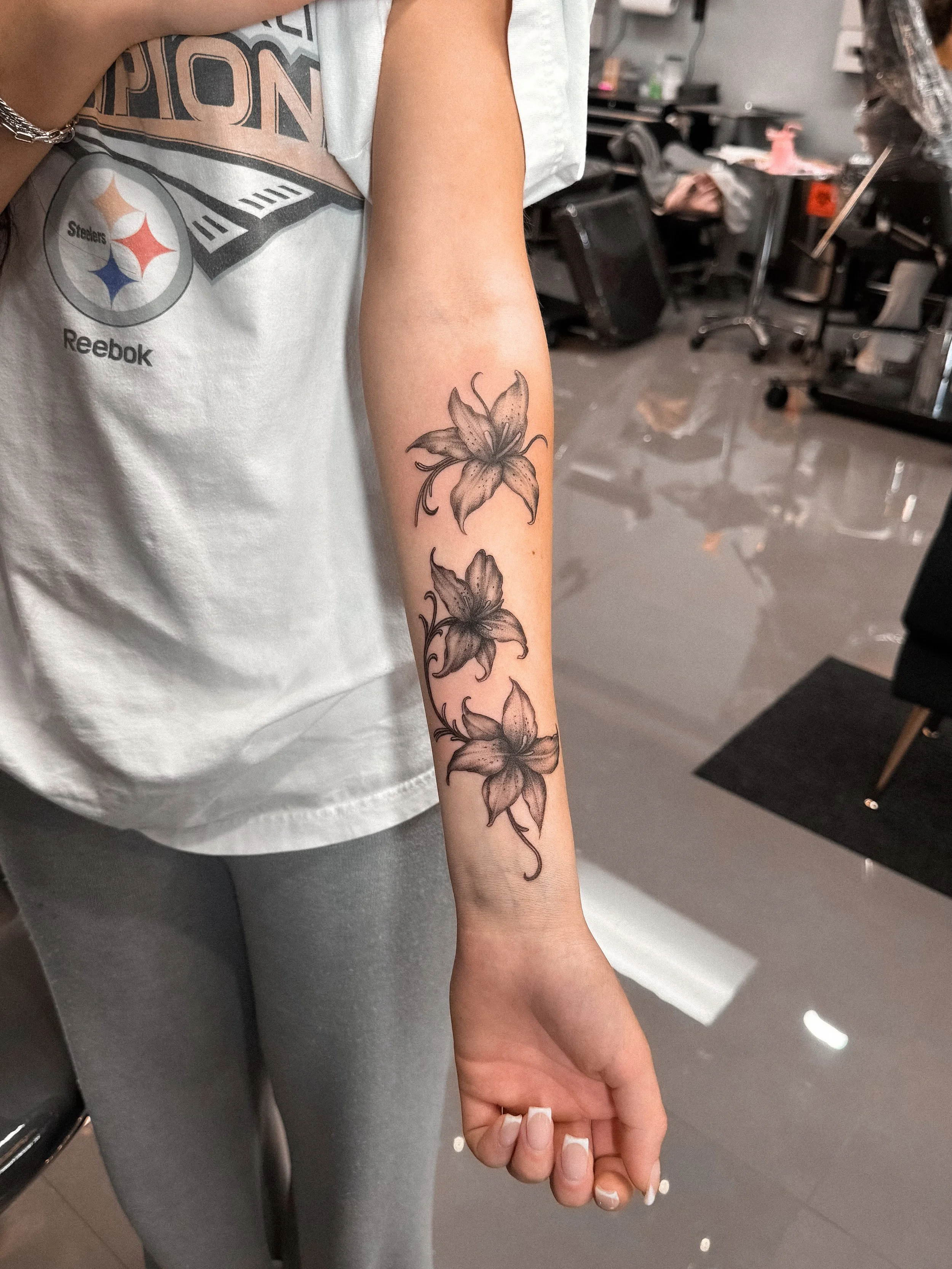 black-and-grey-lily-floral-forearm-tattoo-inkmobster-jenssen-rodas-davie.jpg.jpg