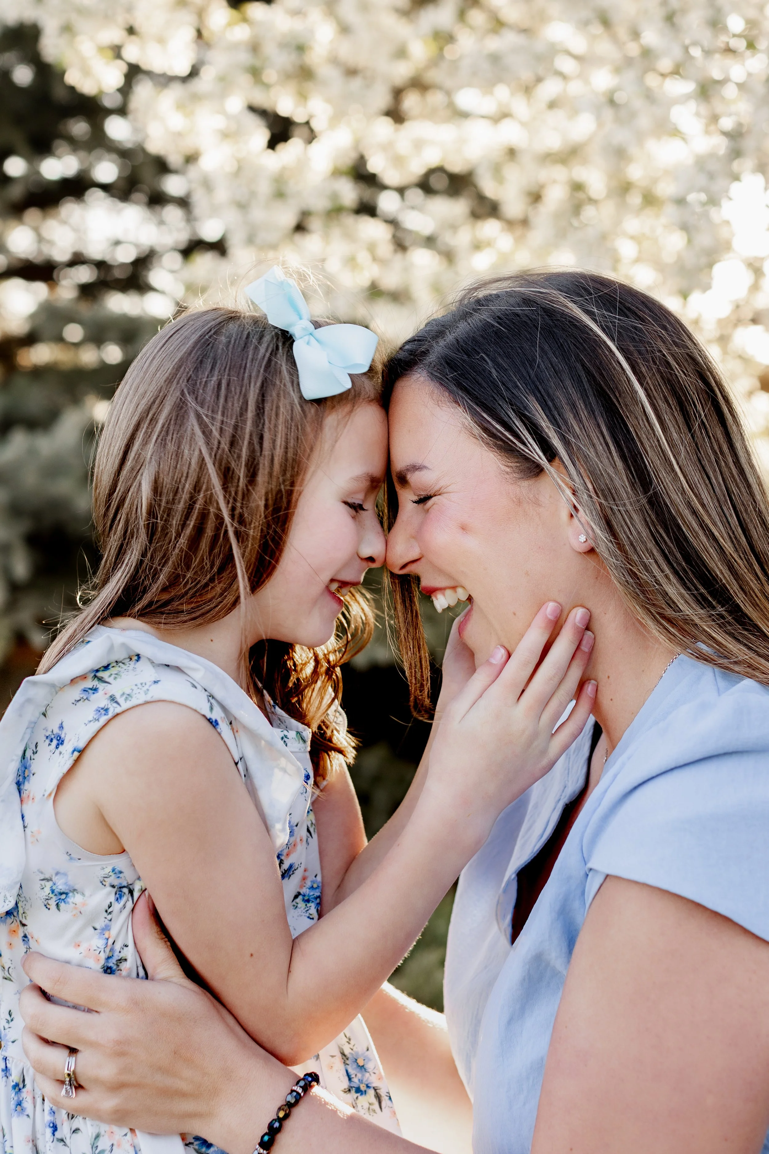 mom-and-daughter-white-trees-flowers-connection-colorado-springs.jpg
