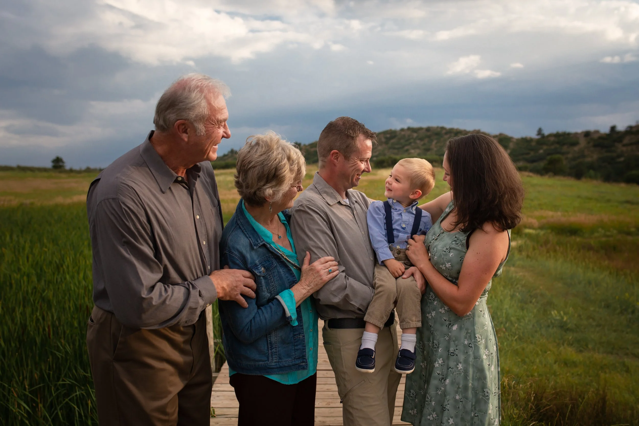 generation-family-grandparents-toddler-boy-connection-field-mountains-colorado-springs.jpg