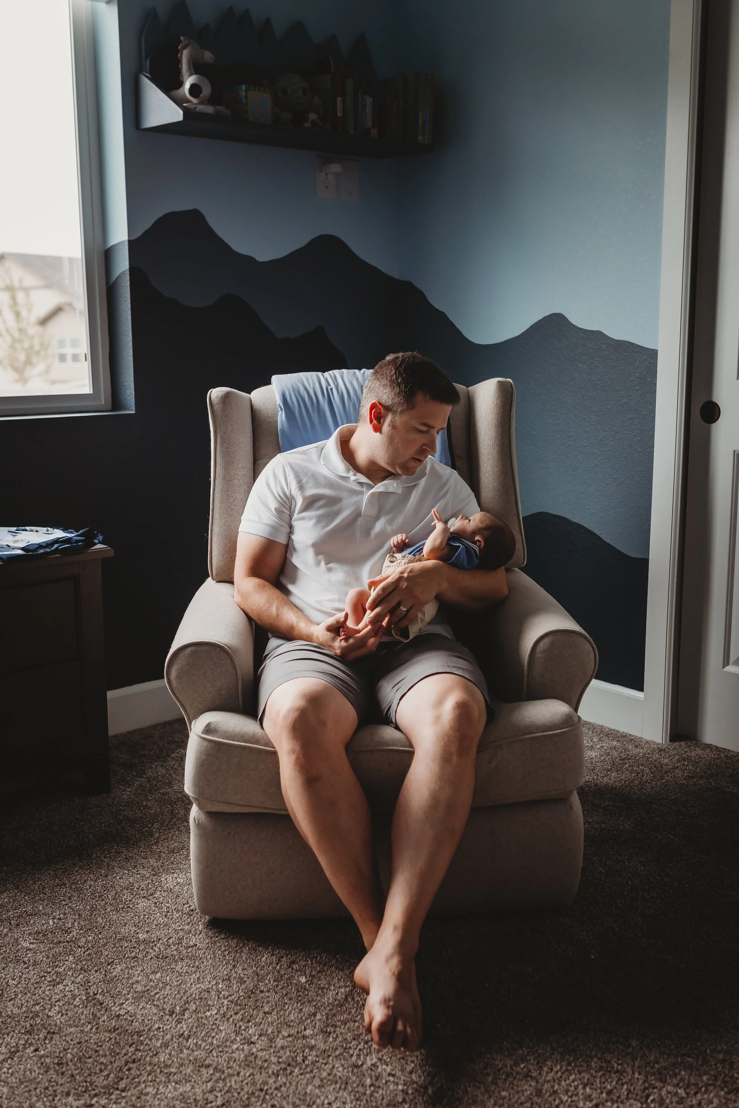 dad-newborn-nursery-in-home-colorado-springs.jpg